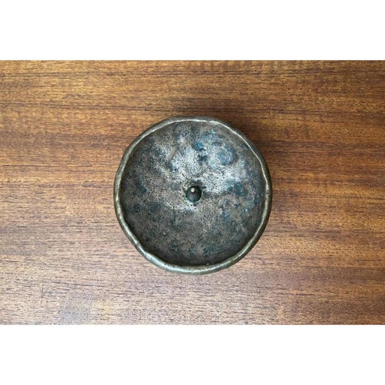 Mid-Century Brutalist Bronze Candleholder, 1960s, in Very Good conditions. Designed 1960 to 1969.

Additional information:
Materials: Bronze
Style: Brutalist, Mid-Century Modern
Color: Gold
Item Type: Vintage, Antique or Pre-owned
Dimensions: 4.72ʺW