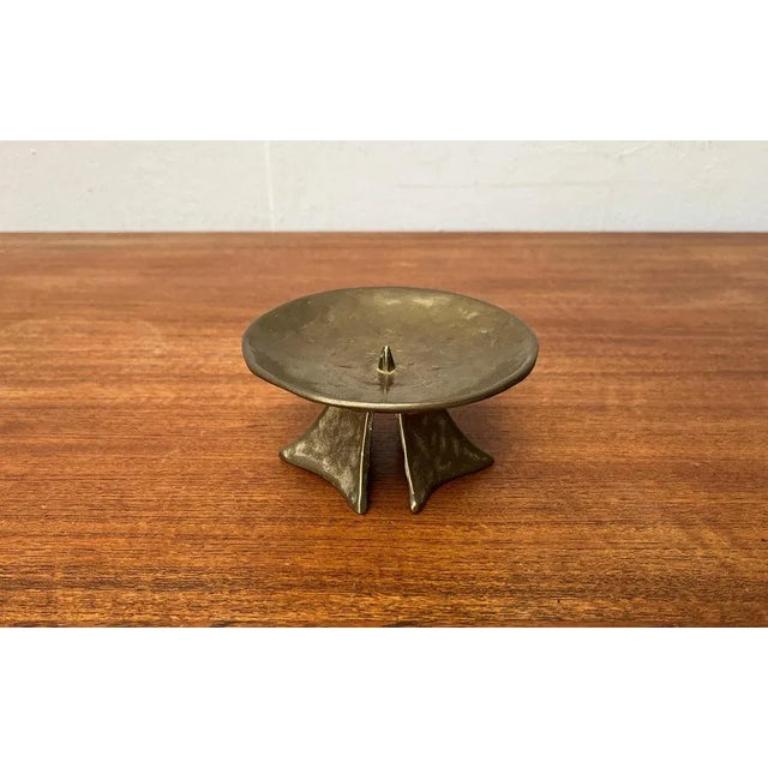 Mid-Century Brutalist Bronze Candleholder, 1960s, in Very Good conditions. Designed 1960 to 1969.

Additional information:
Materials: Metal
Style: Brutalist, Mid-Century Modern
Color: Brown
Item Type: Vintage, Antique or Pre-owned
Dimensions: 5.12ʺW