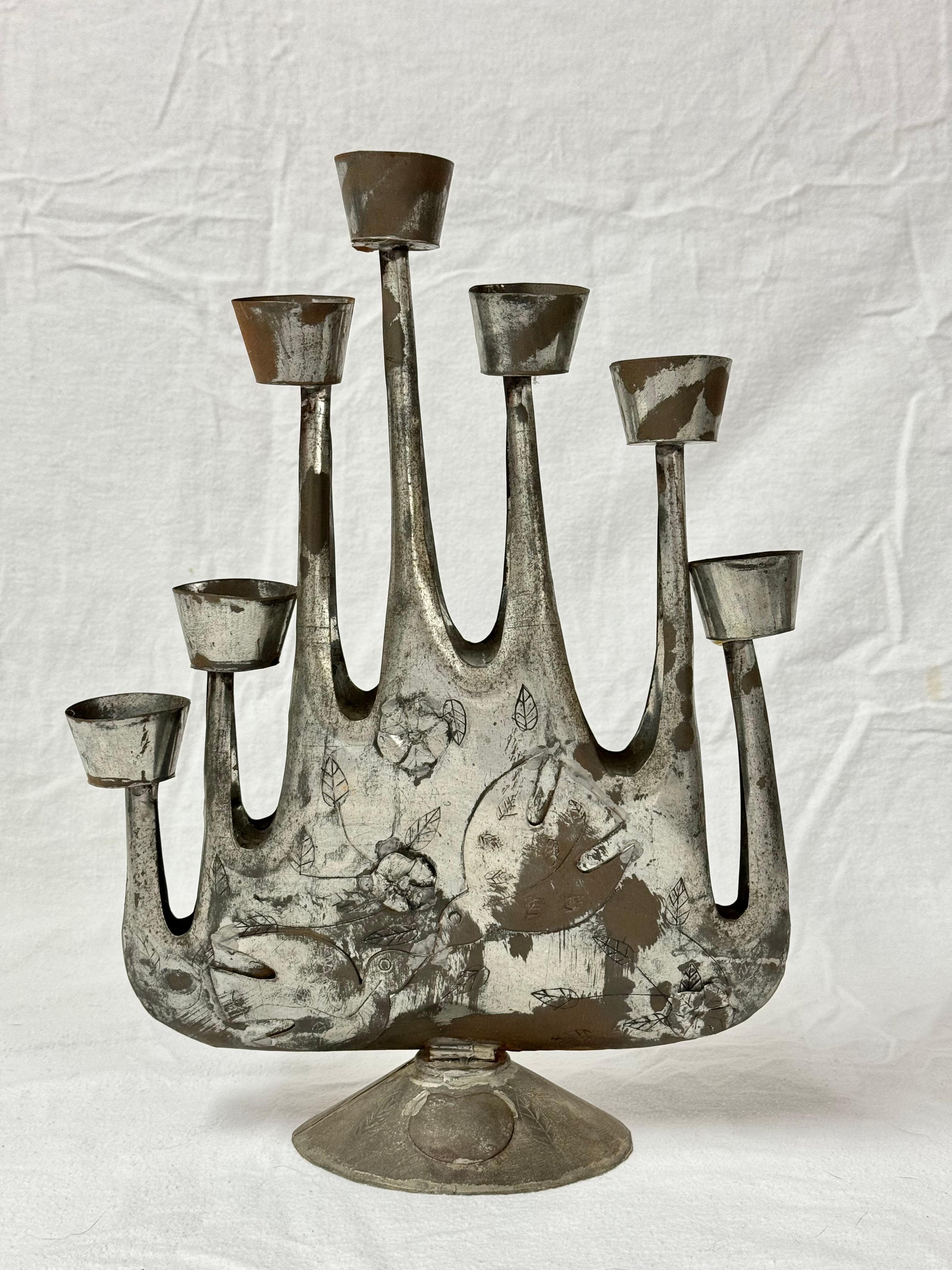Mid Century Brutalist Candelabra by Gene Byron
This decorative Tin Candelabra has applied doves flowers and leaves and has a modernist feel.
Perfect piece for tat romantic table or mantle,