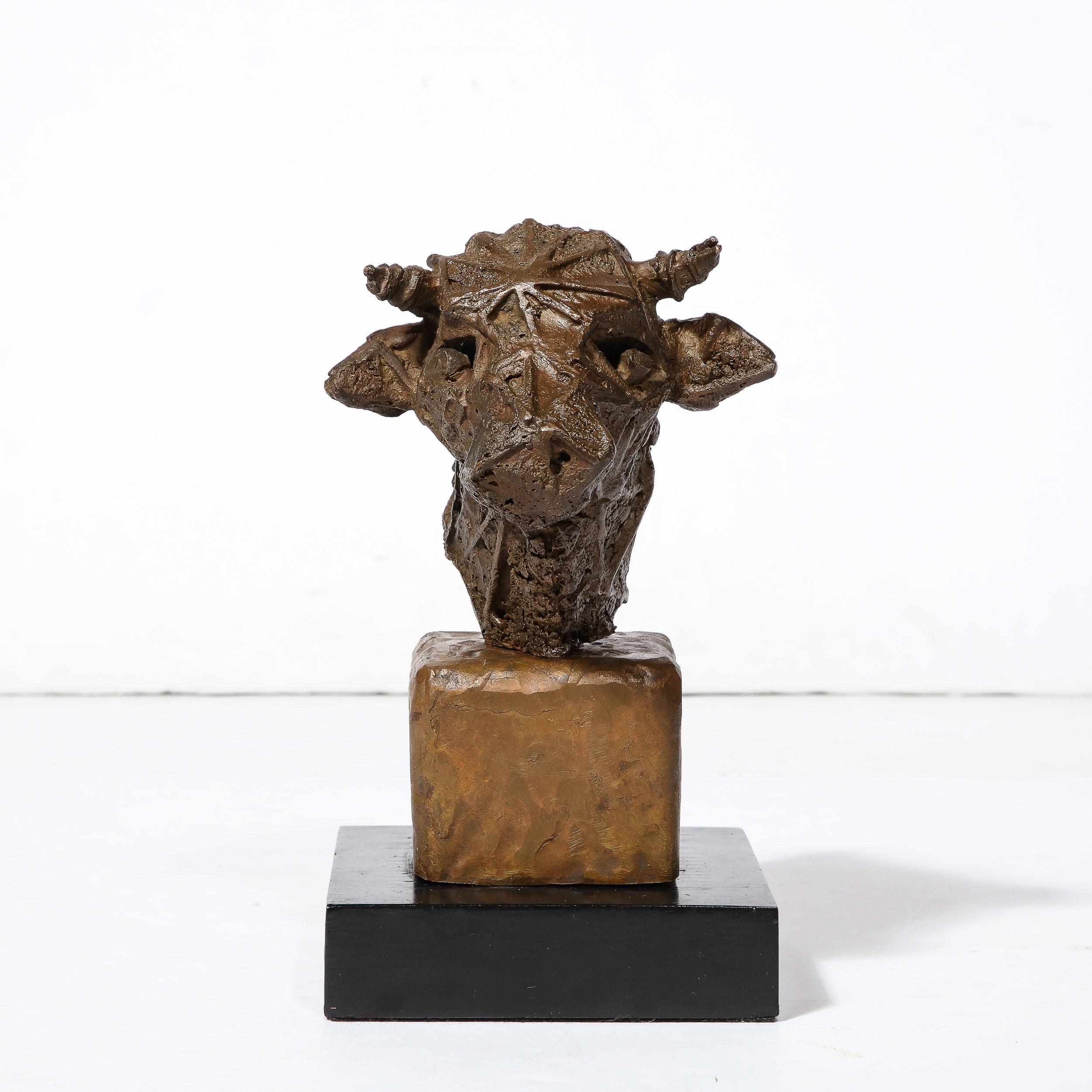 This intrigueing and playful Brutalist Bull's Head Sculpture signed Vlademar Valutis originates from Sweden, created in 1974. Featuring a stylized and texturally intriguing bull's head on a two-part rectilinear base, the maker uses lines of metal to