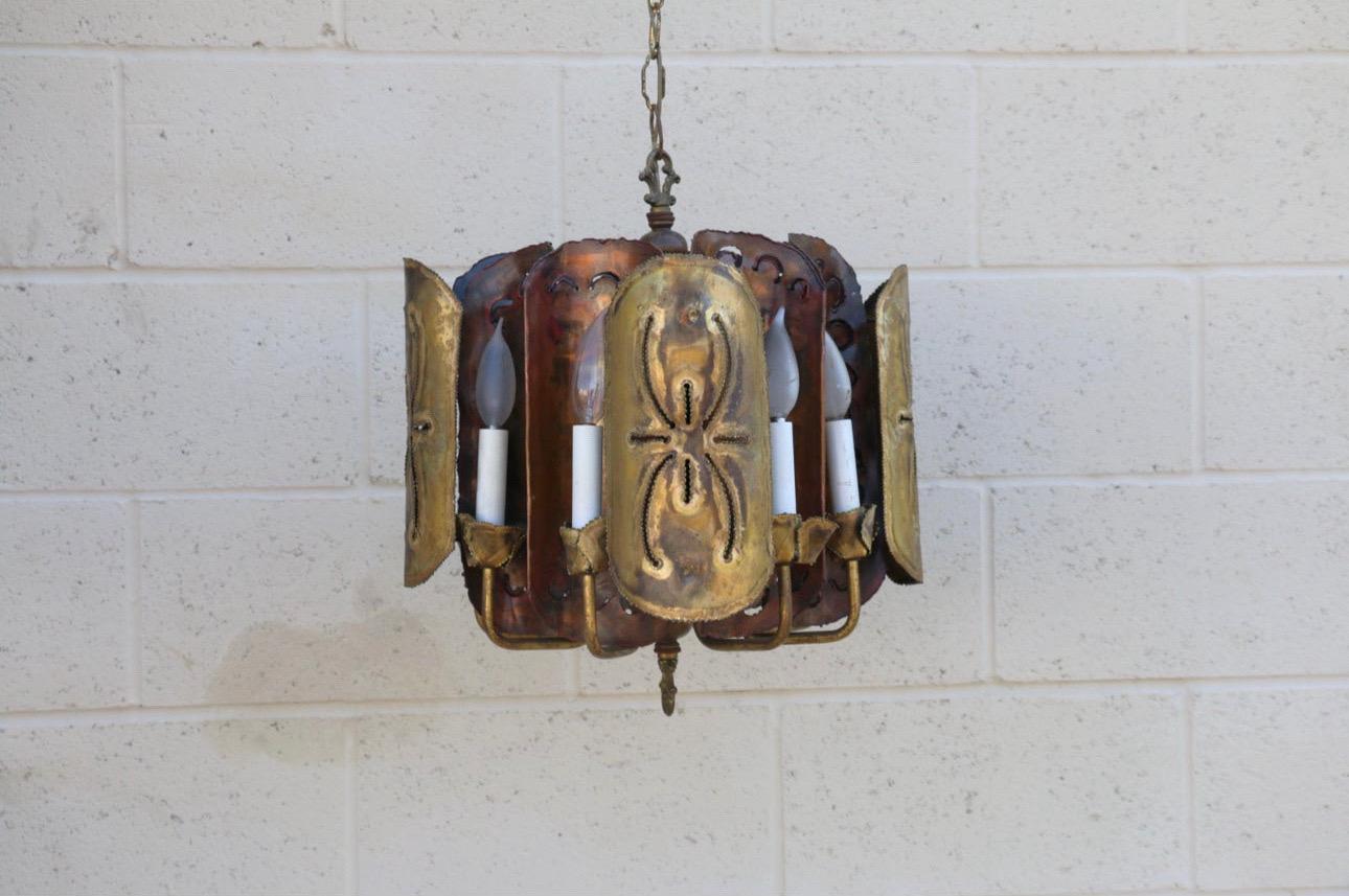 Spectacular Mid-Century brutalist  Chandelier designed by Tom Greene. It doesn’t have any label or stamp of designer. It has been manufactured in the 1960s.It’s made of wood, brass and copper. Amazing forged piece, with a lot of work, and so many