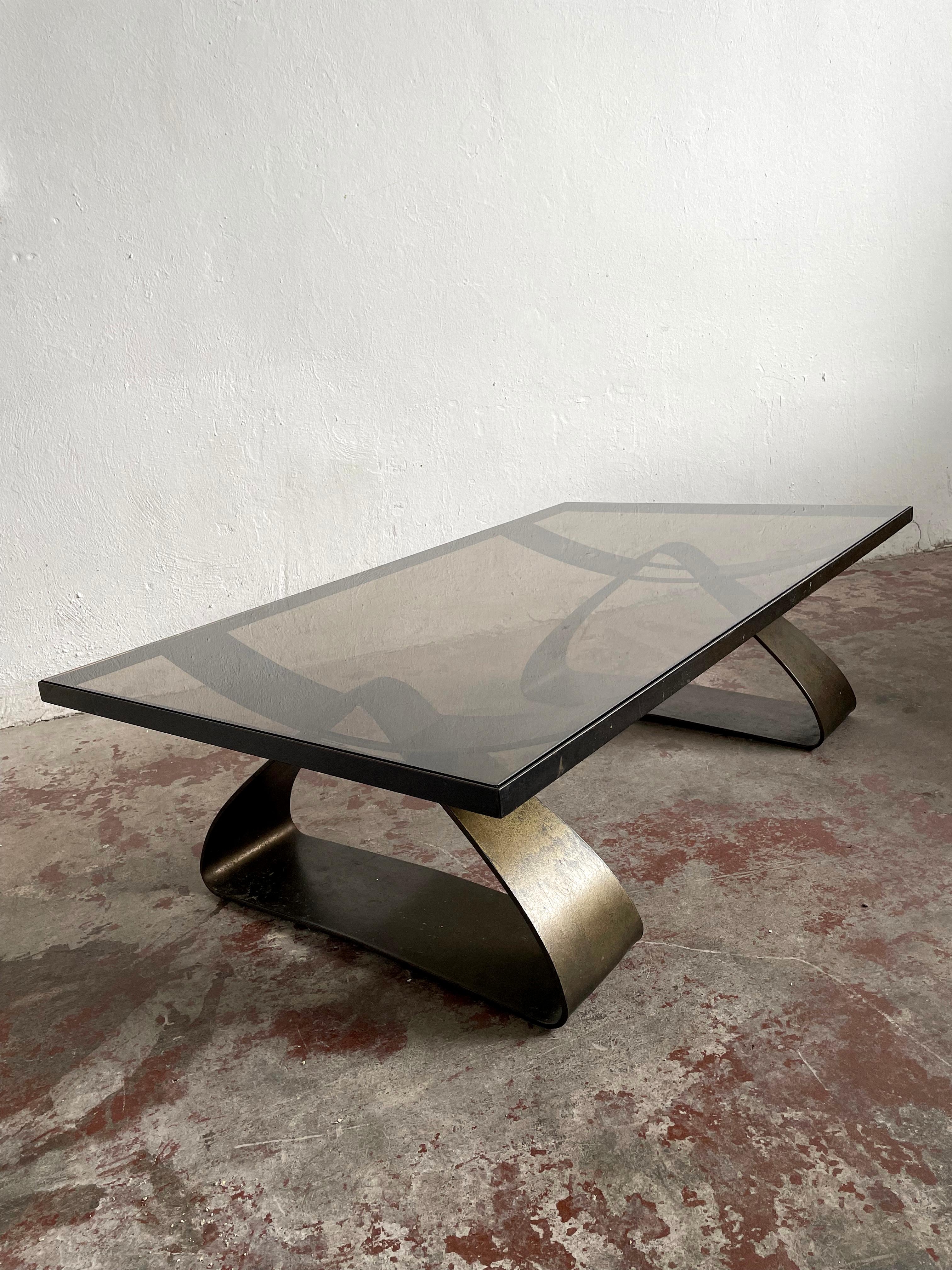 Rare Brutalist mid century large size centre table featuring smoked glass tabletop and very heavy iron frame and legs with a nice patina finish

Unknown provenance

This is a vintage piece and some normal signs of cosmetic wear can be expected.