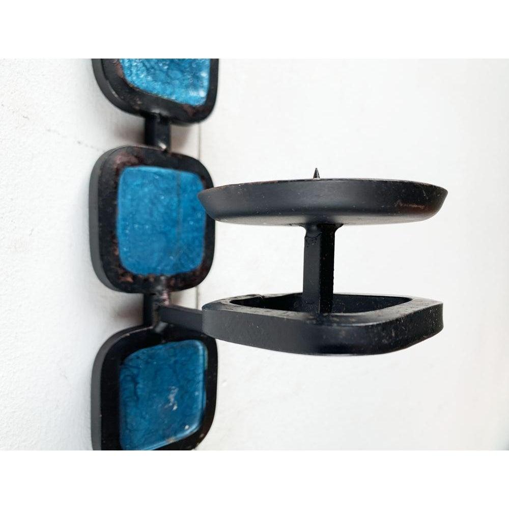 Mid-Century Brutalist Danish Wall Candle Holder from Fema, 1960s, in Very Good conditions. Designed 1960 to 1969 This piece has an attribution mark.

Additional information:
Materials: Metal
Color: Black
Styles: Brutalist, Mid-Century Modern
Country