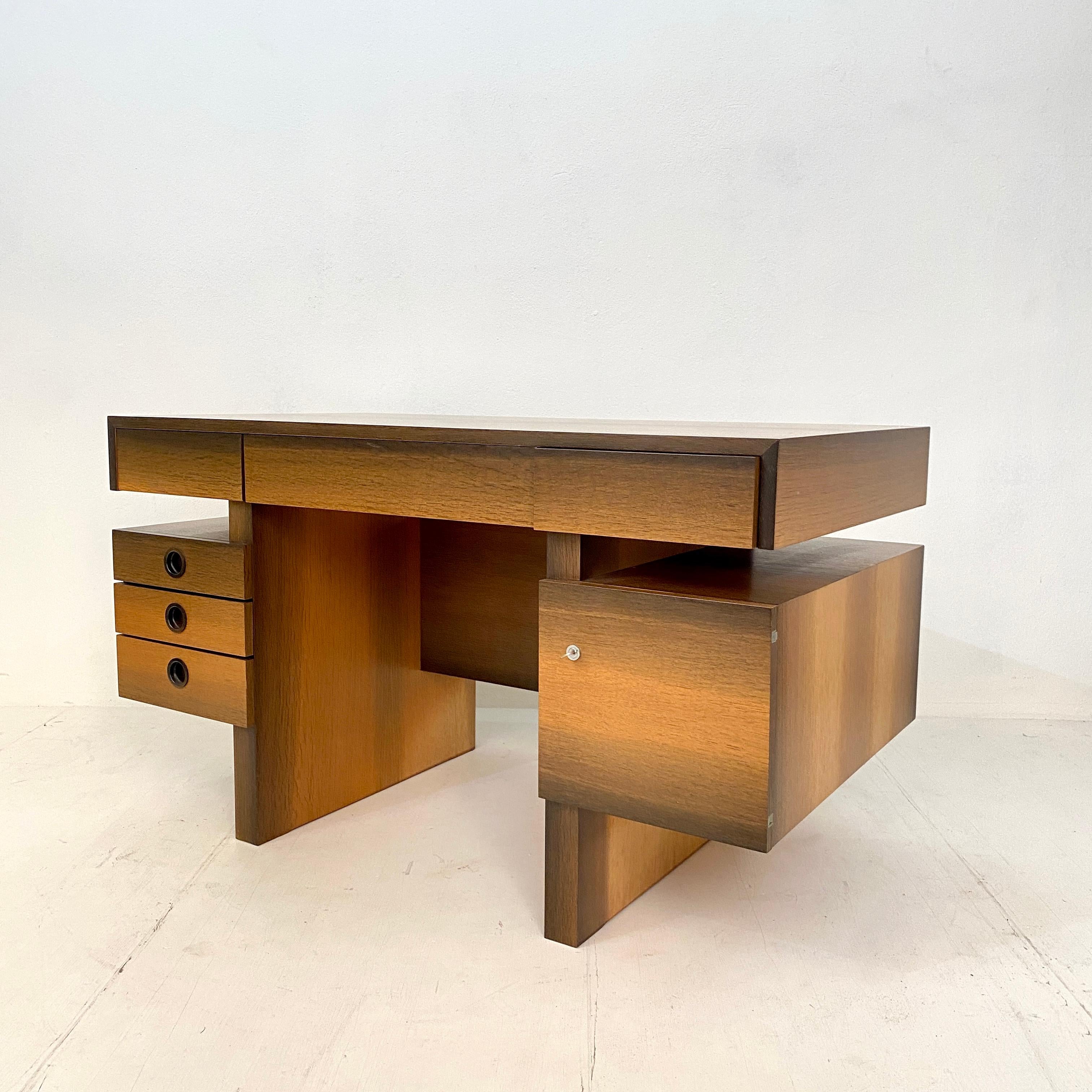 This mid century brutalist desk in bog oak veneer and mahogany was made in 1972 for a house in South Germany.
It is one of a kind and done beautifully by the carpenter. 
As the writing table was not used a lot it is in perfect condition. 
It can