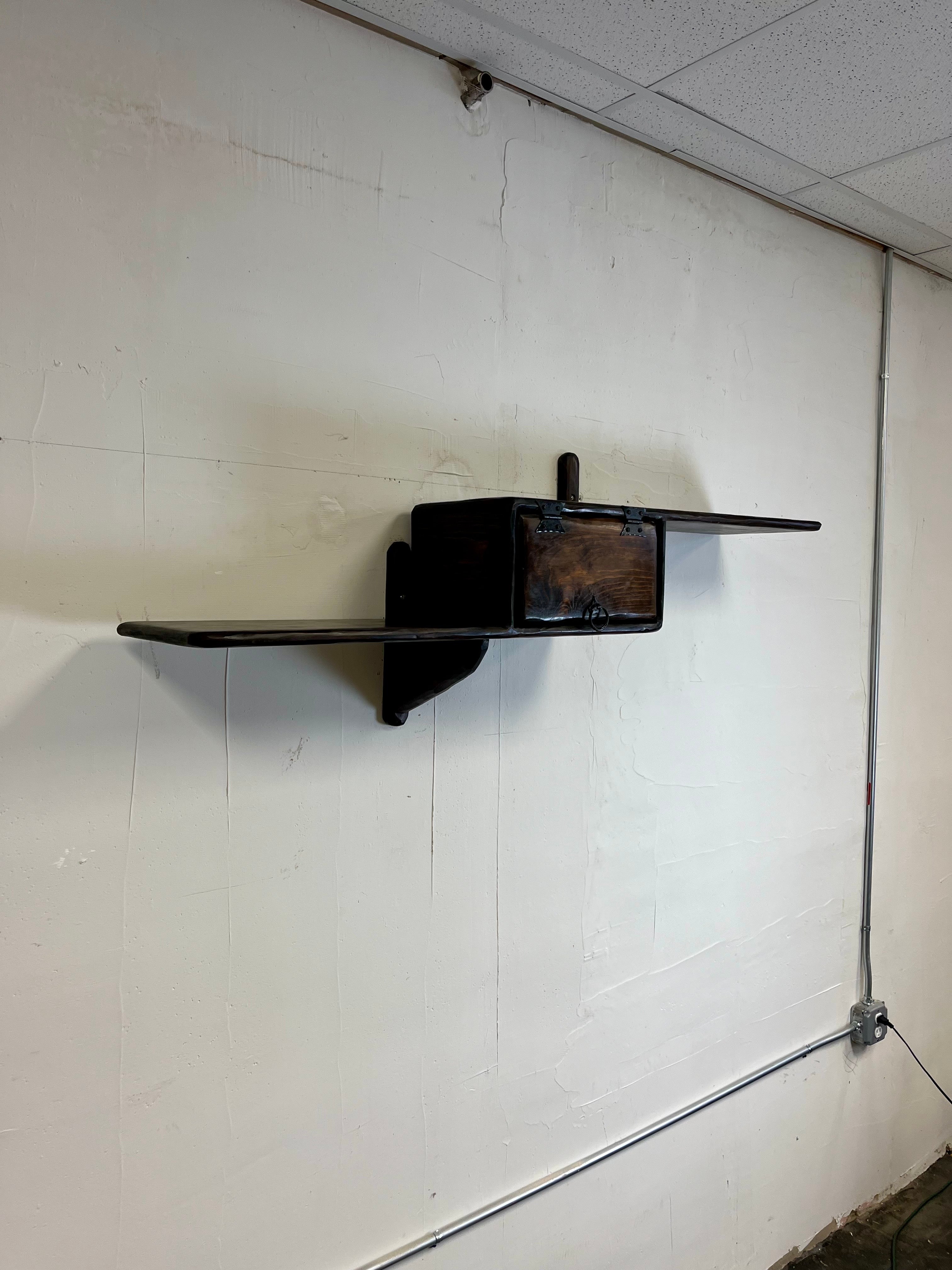 Very RARE brutalist floating wall shelf by famed architect Peter Asher out of the East Village circa 1960's. Quality design and craftsmanship. Asher designed the famous Dune House on Fire Island, NY at the height of the mid century beach house