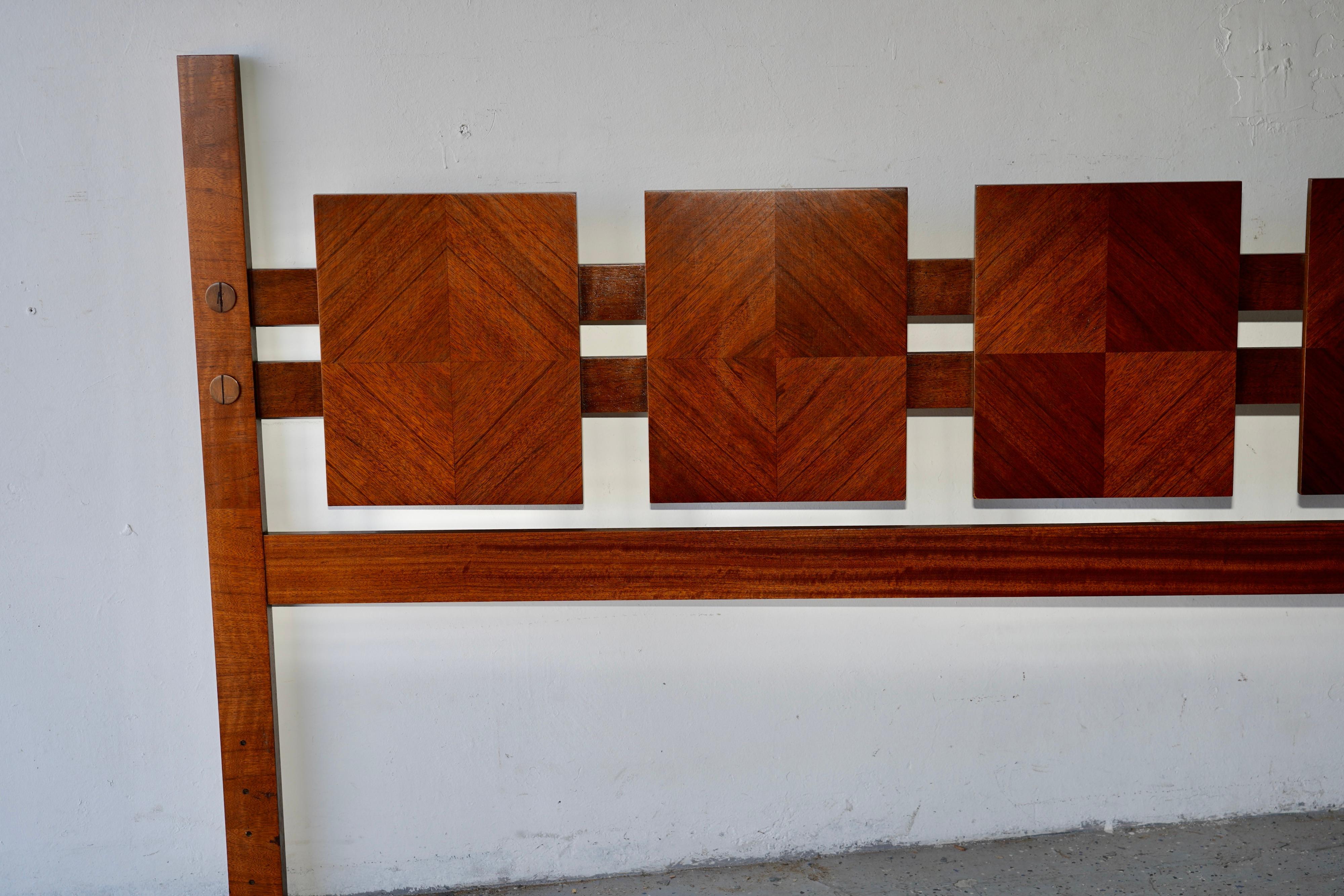This striking Lane Brutalist headboard, inspired by Paul Evans, features a mid-century modern design crafted in rich walnut. The headboard has been meticulously refinished to restore its original elegance and enhance its unique