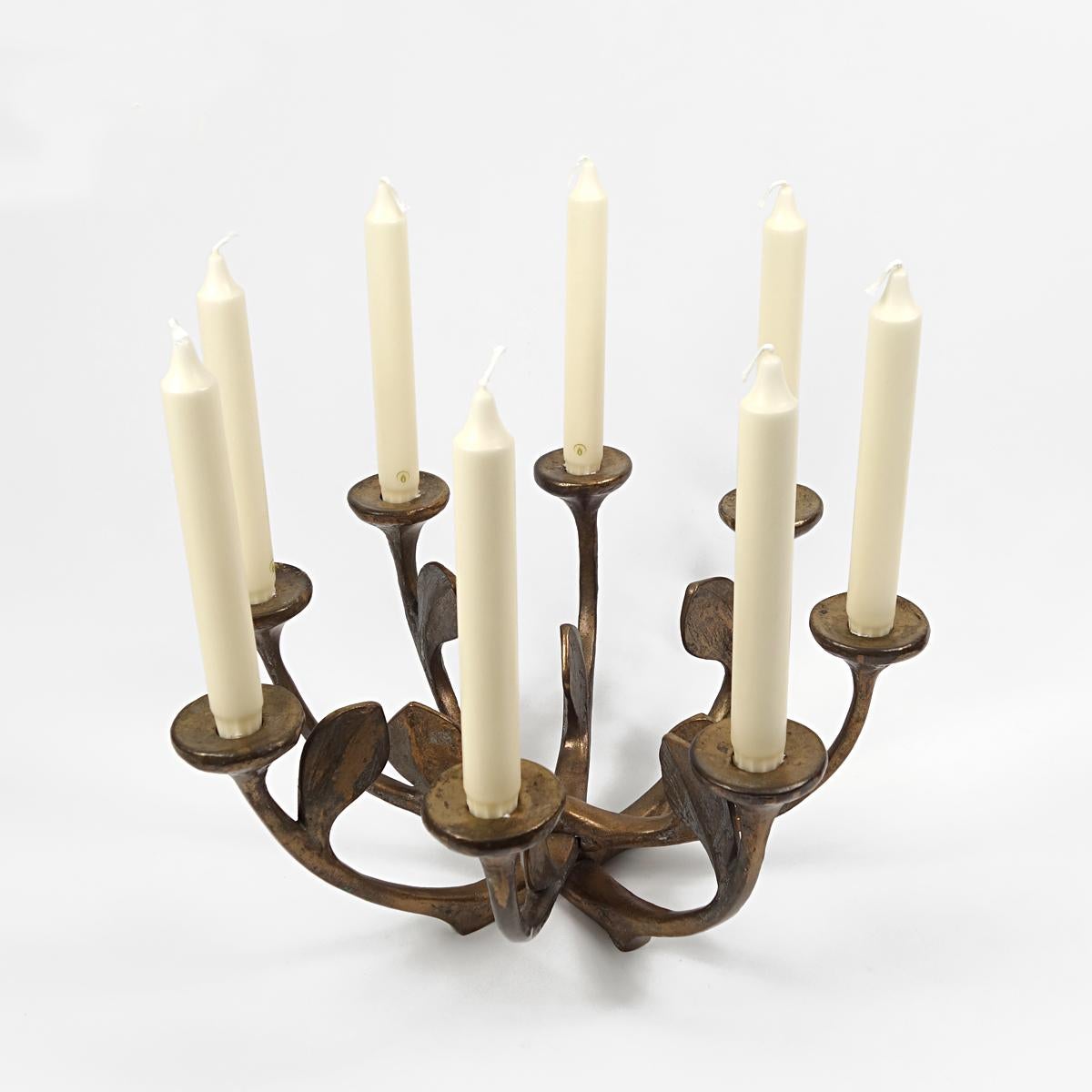 Mid-century brutalist style large and heavy bronze 8-armed candelabra by Michael Harjes from Germany.

This exceptionally large centerpiece is an attractive piece of brutalist casting. The organically shaped arms are styled like an airy bunch of