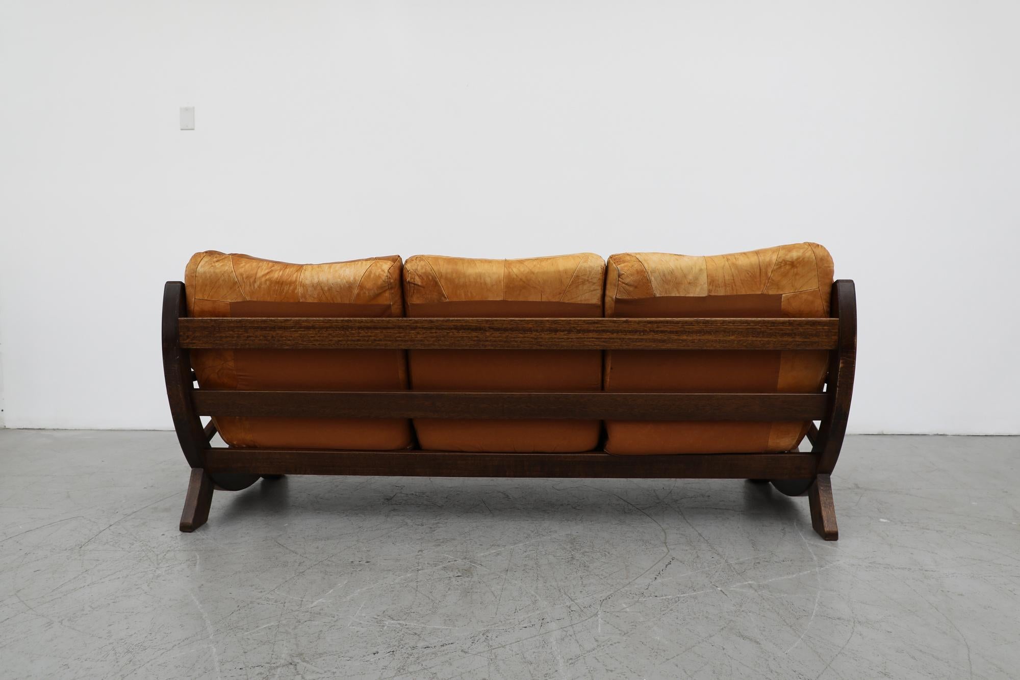 Mid-Century Brutalist Brown Leather Patchwork Sofa with Western Style Wood Frame In Good Condition For Sale In Los Angeles, CA