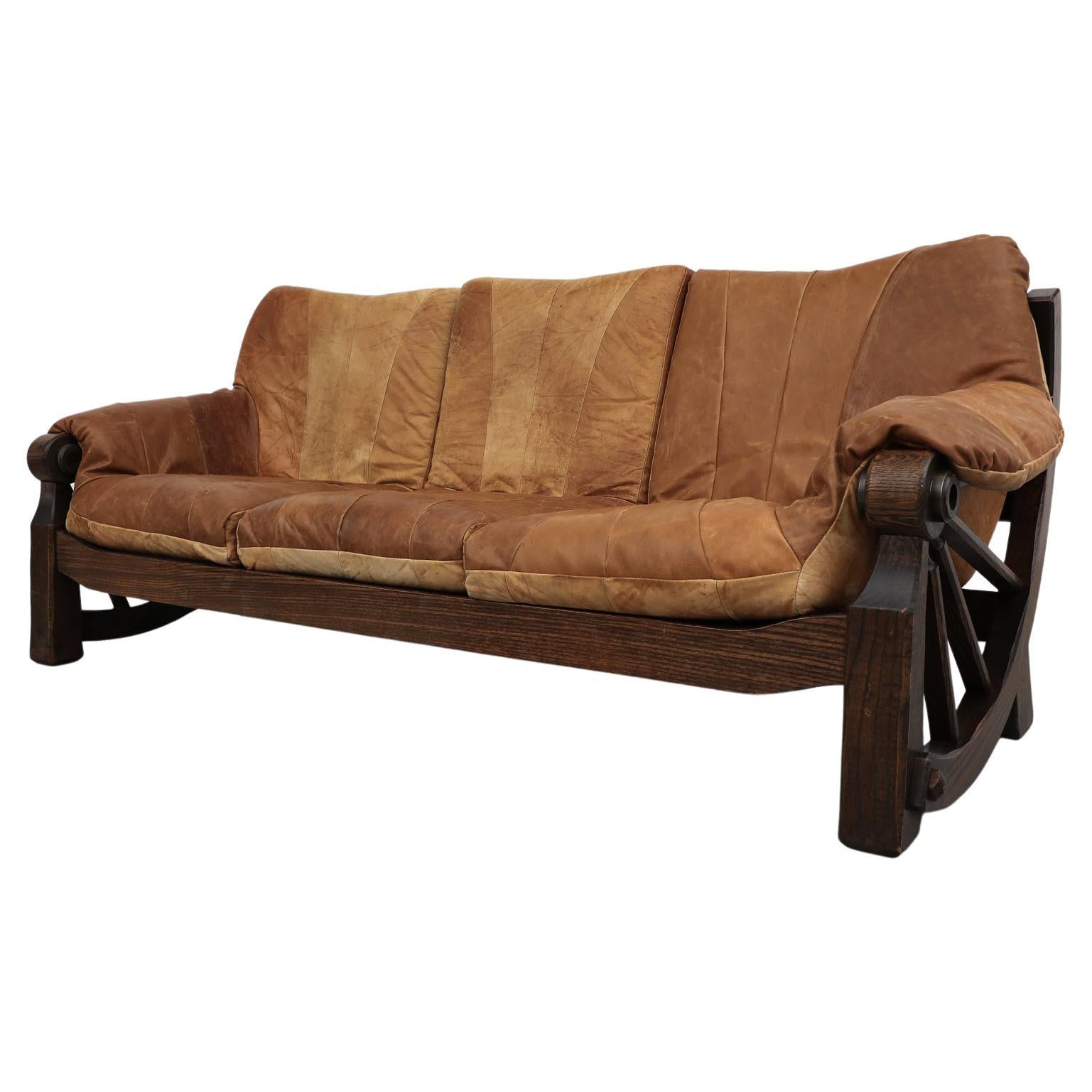 Mid-Century Brutalist Brown Leather Patchwork Sofa with Western Style Wood Frame For Sale