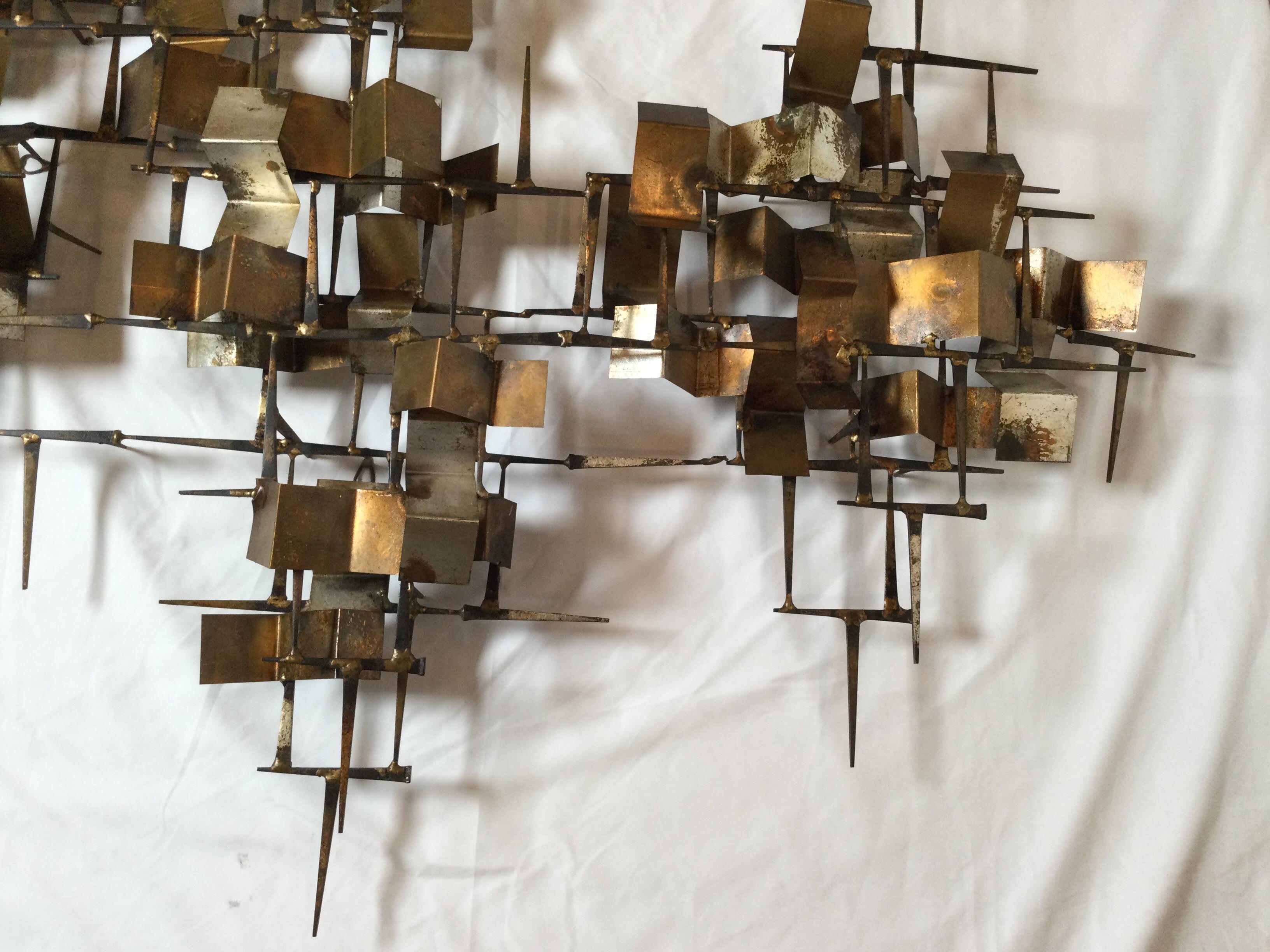Midcentury Brutalist metal silver gold gilt and copper nail art wall sculpture in the style of Jere or Bertoia. Can hang with size interchangeable. Measures: 6 inch deep, 50 wide, 48 inch high. Age appropriate wear and some minor rust and gilt loss.
