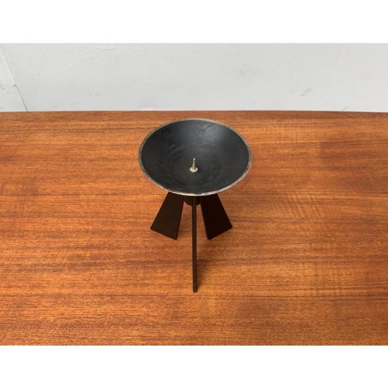 Mid-Century Brutalist Metal Tripod Candleholder, in Very Good conditions. Designed 1960 to 1969

Additional information:
Materials: Metal
Style: Brutalist
Period: 1960s
Color: Black
Item Type: Vintage, Antique or Pre-owned
Dimensions: 4.33ʺW ×