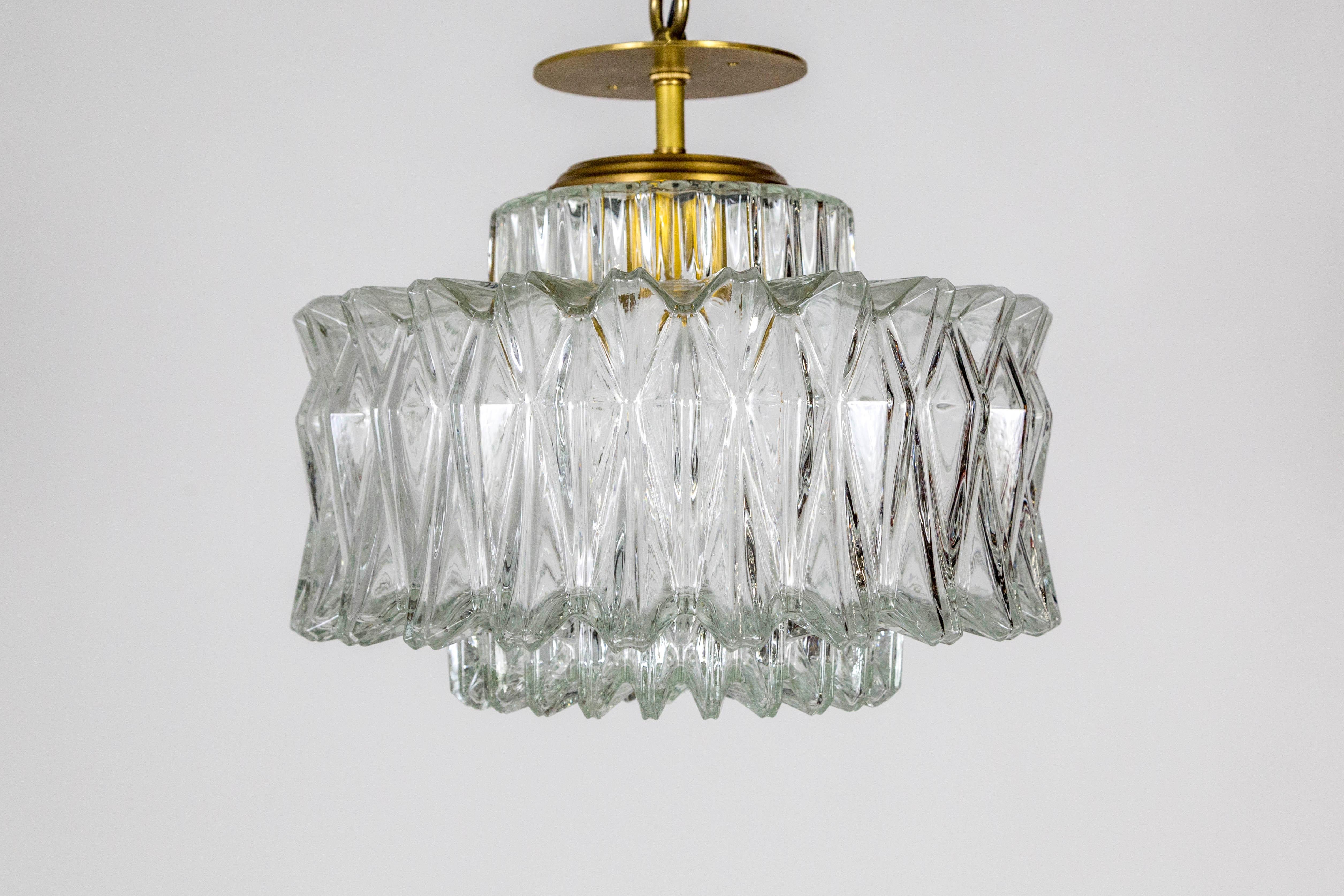 A Brutalist style, large, chunky, multifaceted, molded glass shade made by Glashutte Limberg in the 1960s. Newly fashioned into a pendant light with a short, brass stem and shade holder. Measures: 13