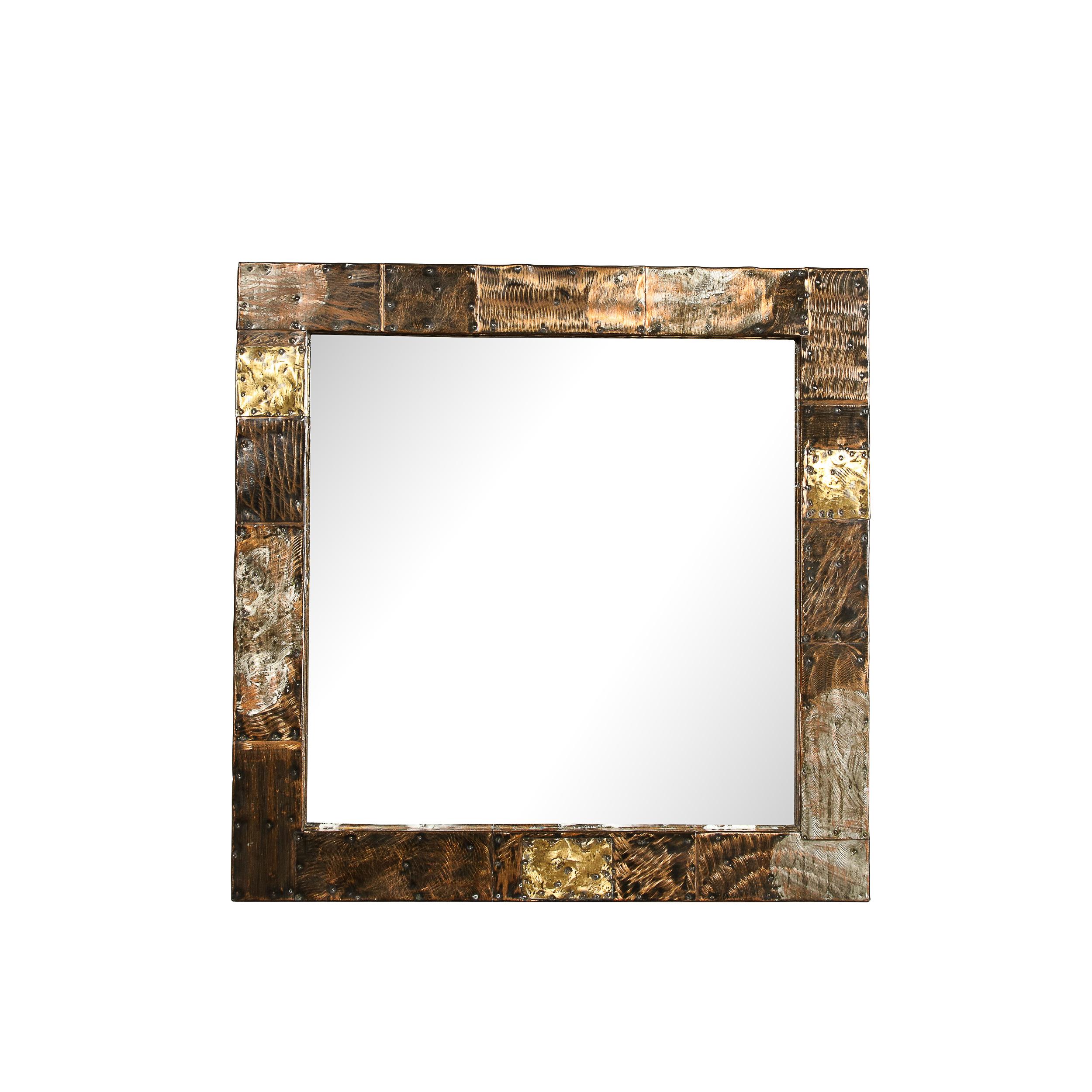 This striking and rare Mid-Century Brutalist Patchwork Mirror & Console was made by Paul Evans and originates from the United States Circa 1970. Featuring a bold and beautifully crafted square frame in the Patchwork technique Evans has explored