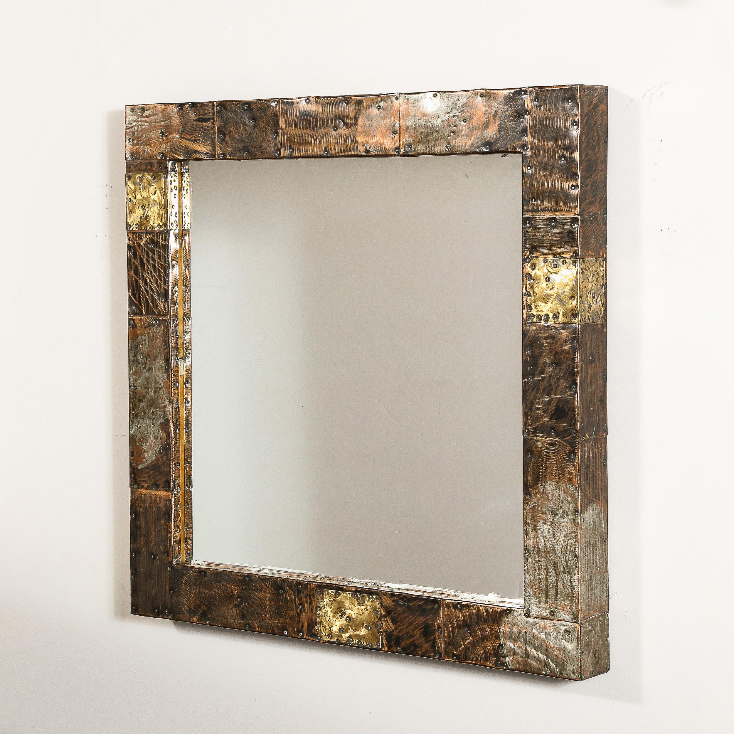 This striking and rare Mid-Century Brutalist Patchwork Mirror was made by Paul Evans and originates from the United States Circa 1970. Featuring a bold and beautifully crafted square frame in the Patchwork technique Evans has explored through his