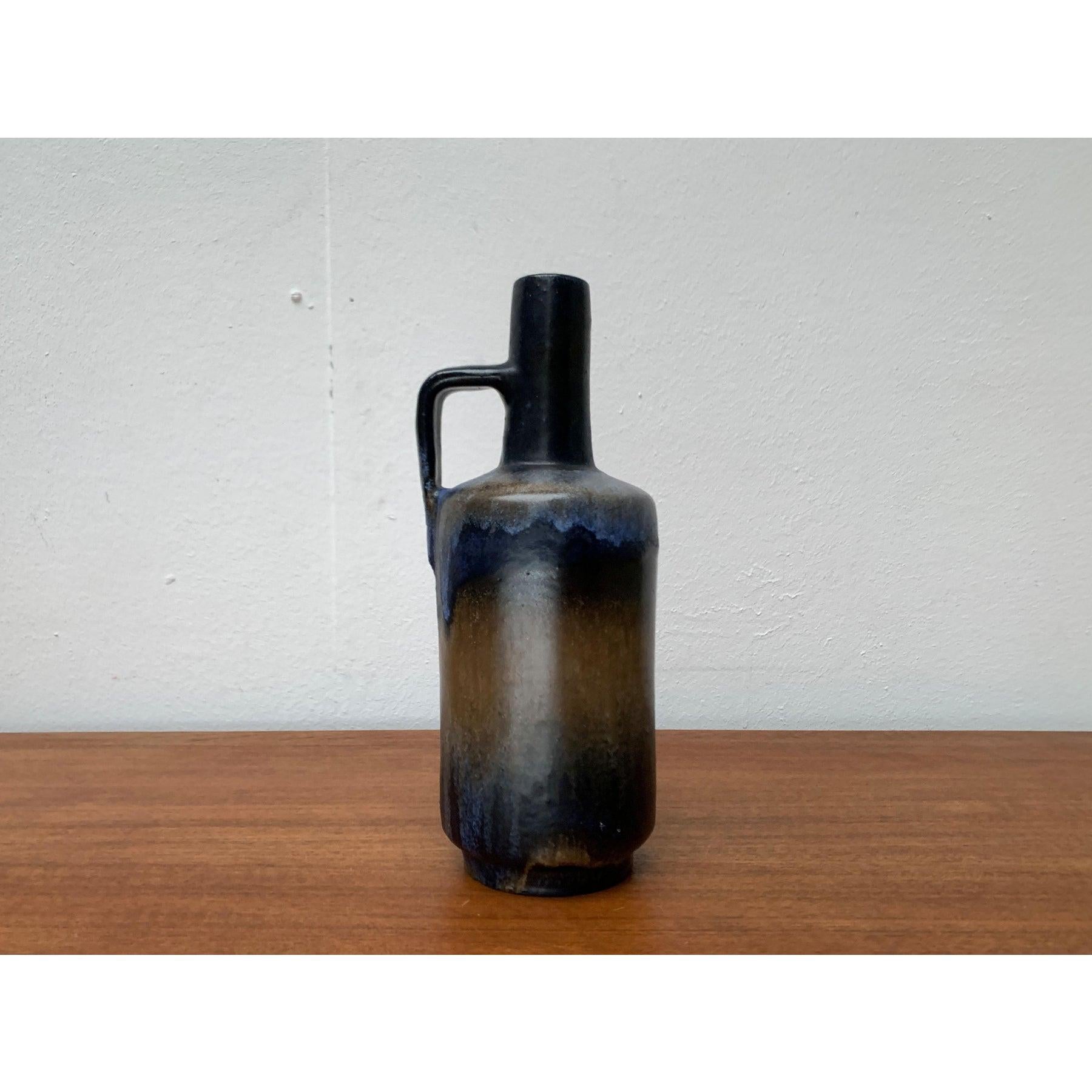 Mid-Century Brutalist Pottery Carafe Vase from Ruscha, West Germany, 1960s, in Very Good conditions. Designed 1960 to 1969 Official proof of authenticity such as vintage catalogs, designer records.

Additional information:
Materials: Ceramic
Color: