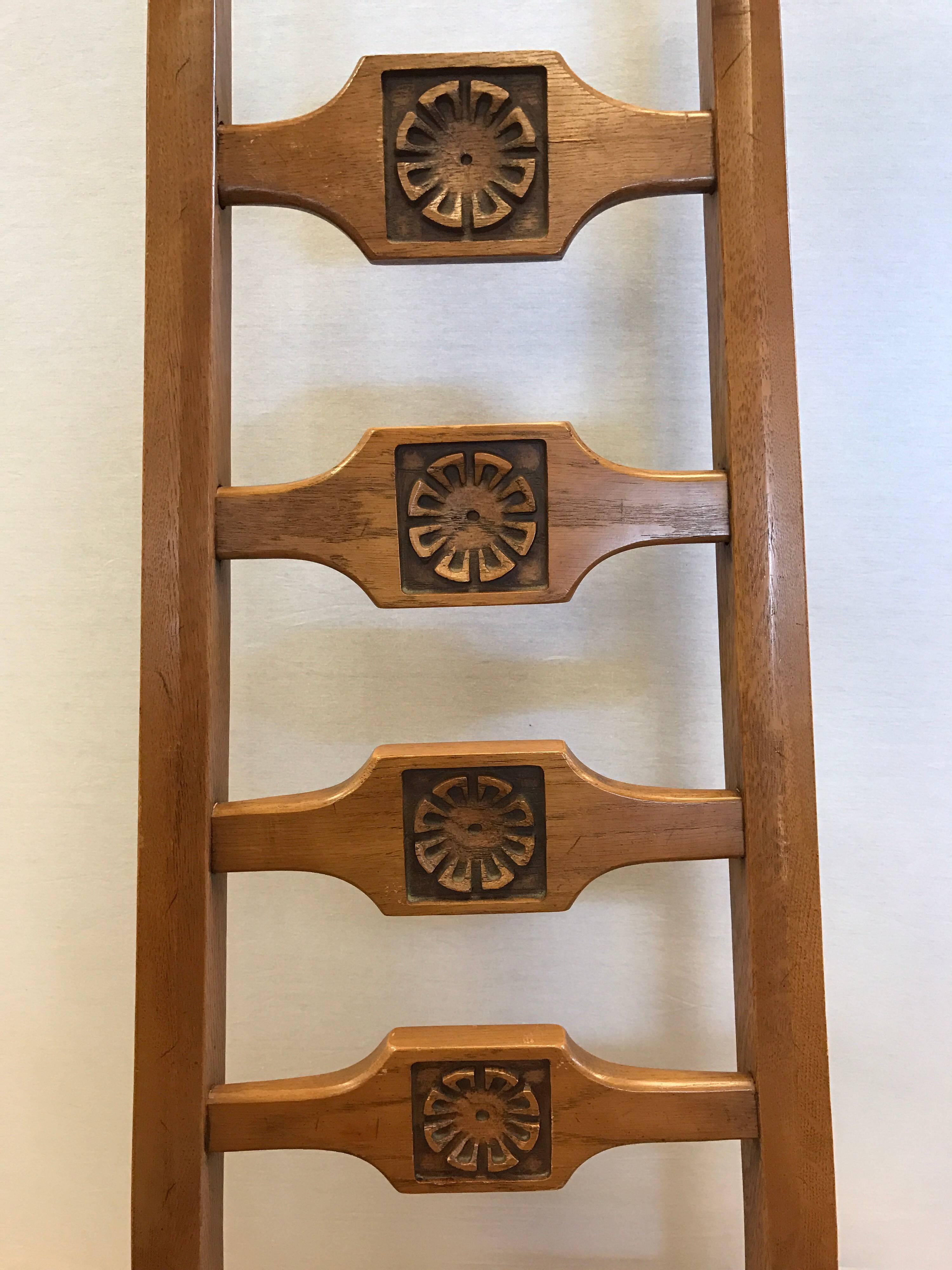A set of Pearsall inspired Brutalist oak wood dining chairs with a very unusual repeating carved floral medallion at backrest of each of the six chairs. This is a matching set with two armchairs and four side chairs.