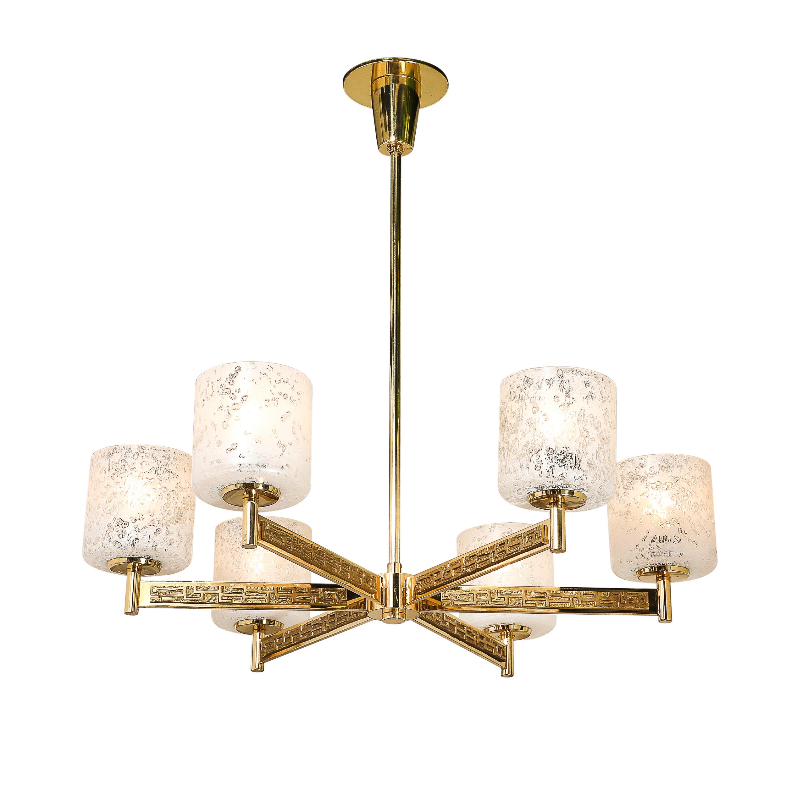 This commanding mid-century chandelier embodies the bold aesthetic of Brutalist design while maintaining a refined, artistic sensibility. Crafted in Italy circa 1970, it features six arms fashioned from textural brass, showcasing a dynamic interplay