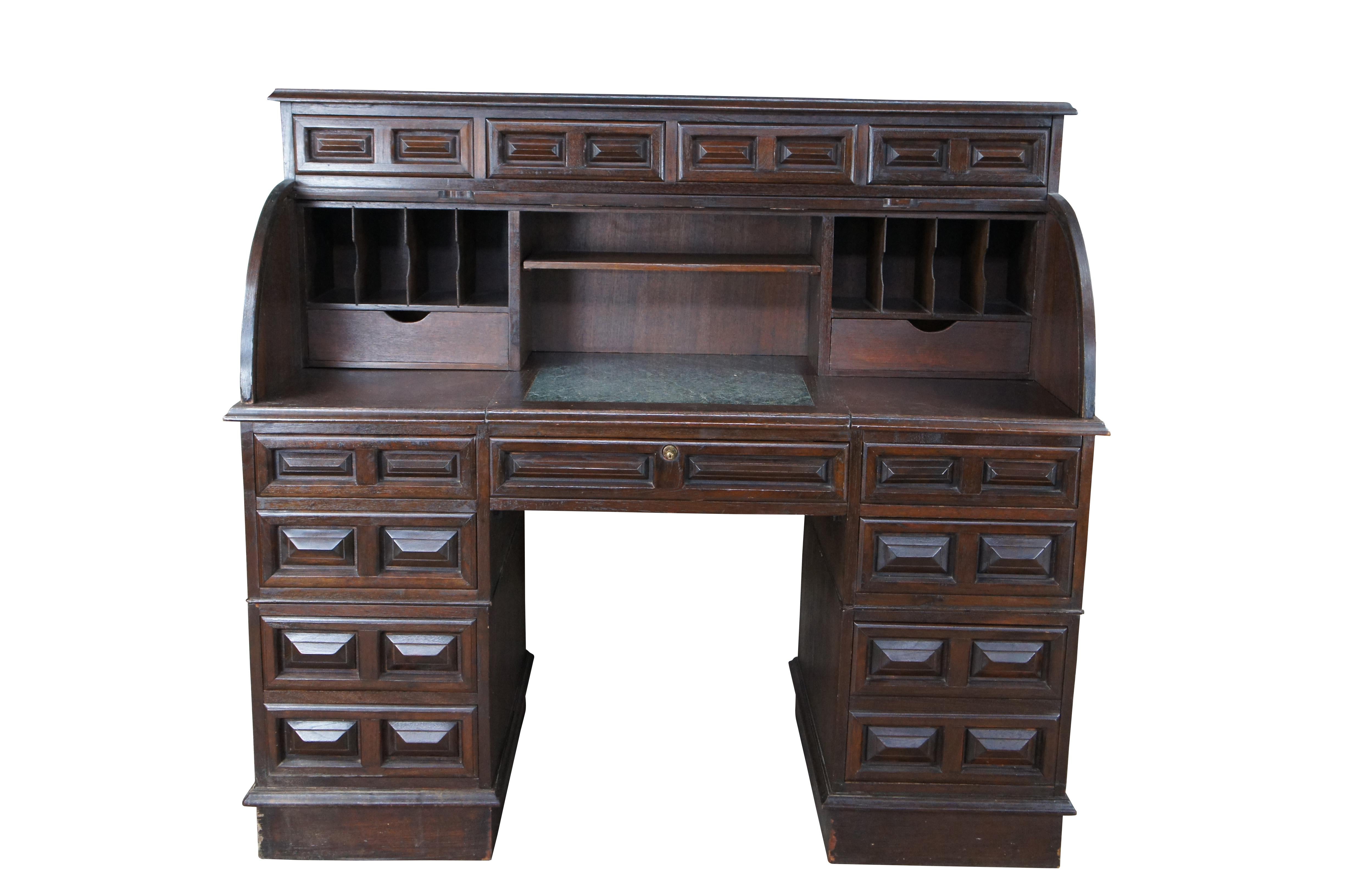 A quaint mid century Brutalist style office desk.  Features a dark oak finish and half cylinder form that opens to cubbies and a green marble work surface flanked by a Matchbook 