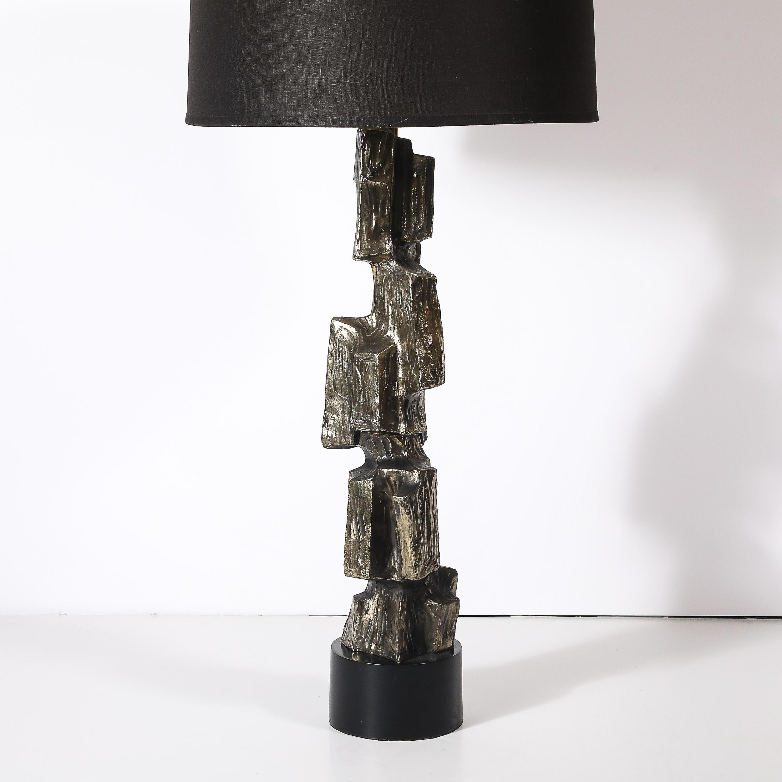 Designed by Italian-American designer Maurizio Tempestini, this Mid-Century Brutalist table lamp for the Laurel Lamp Company is a masterful blend of sculptural artistry and functionality. Crafted in the 1960s, the lamp exemplifies the Brutalist