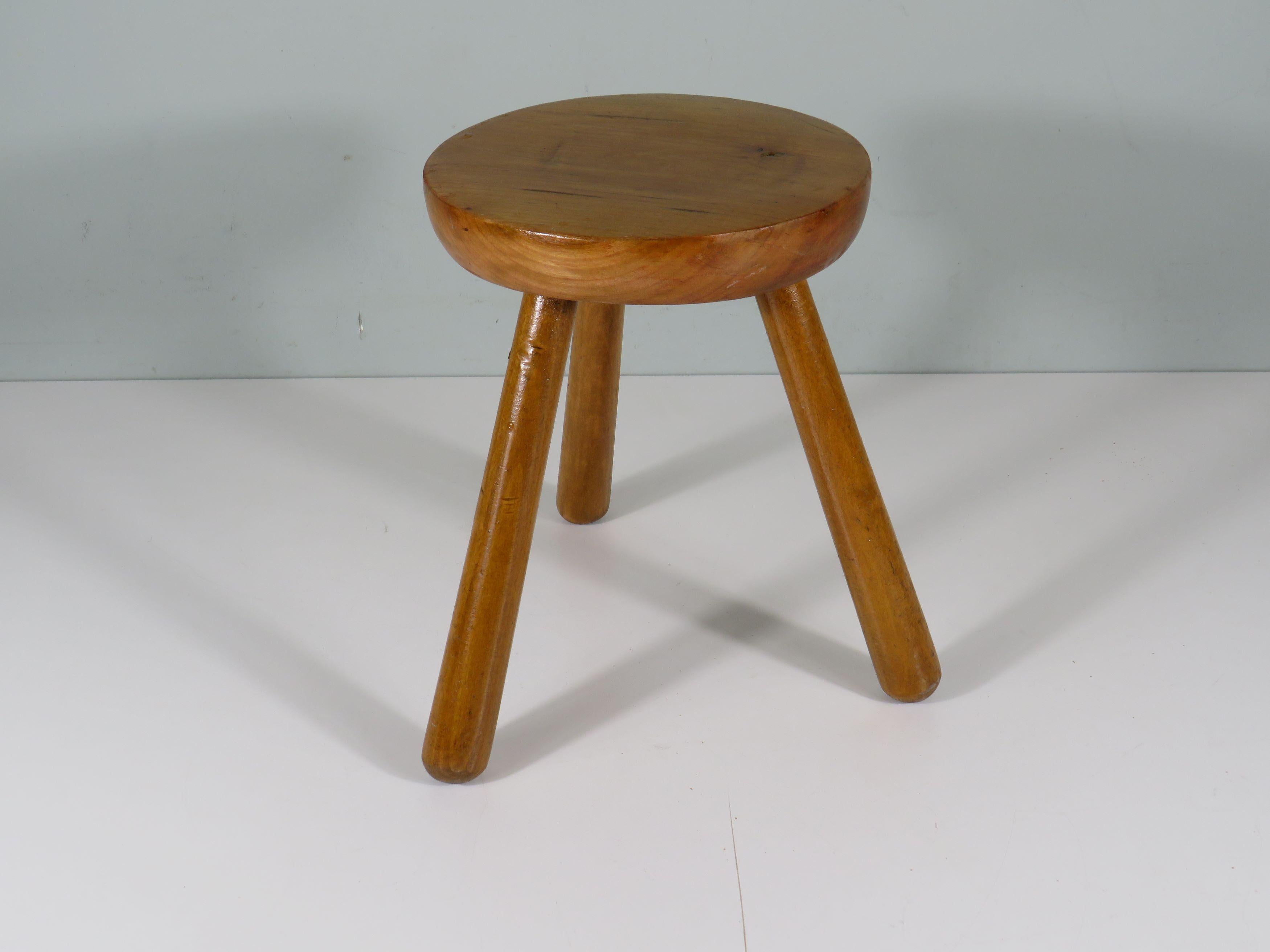 Tripod stool with round, tapered legs.
The stool has a thick, solid wooden diagonally rounded seat.
It is in good, sturdy condition with signs of wear consistent with its age, but these make the stool just as charming.
Height: 28.5 cm. seat