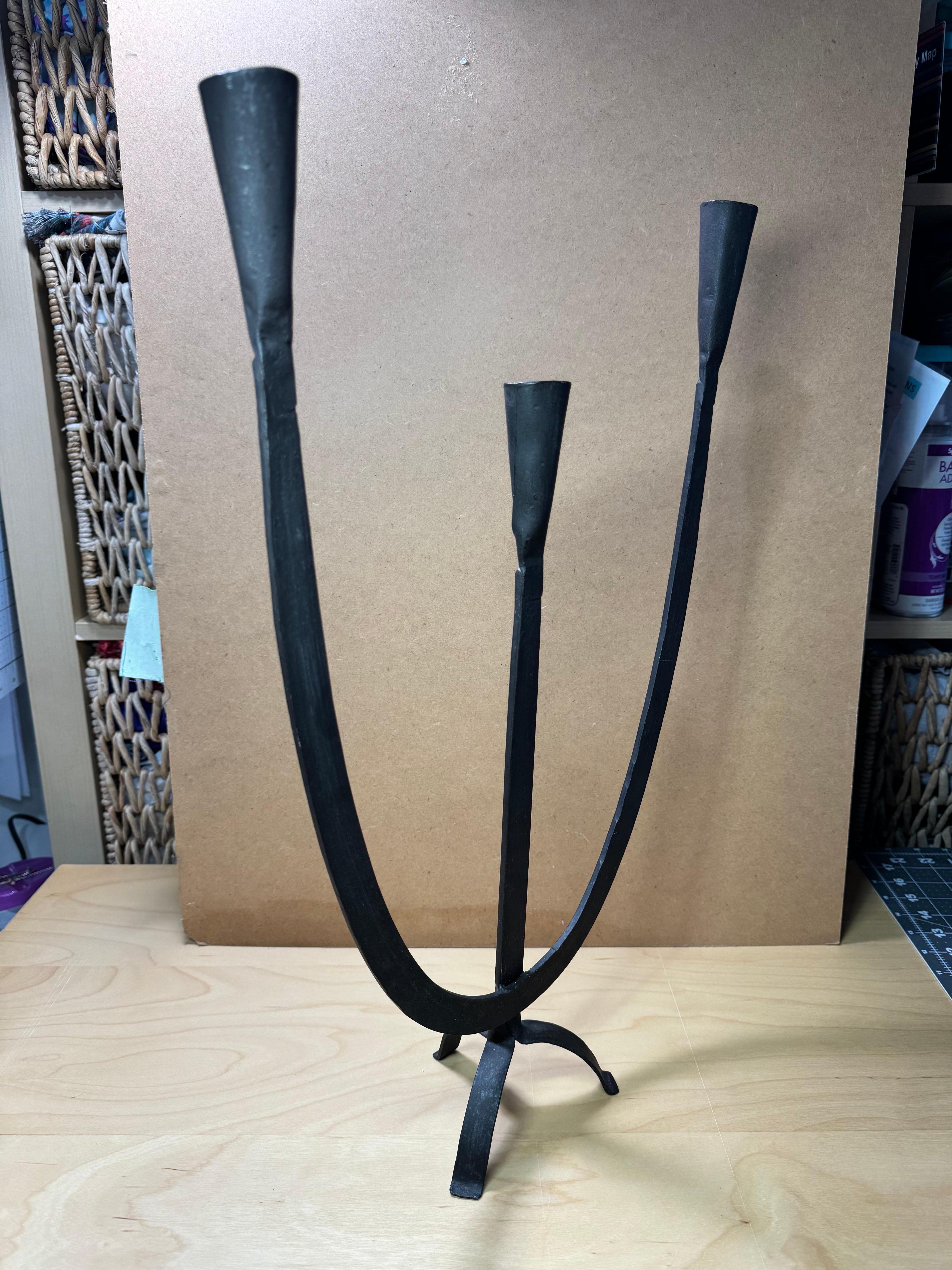 Beautiful handcrafted wrought iron mid century modern brutalist style candelabra, with a bold and dramatic design certain to attract attention and make a statement in any room.
This candelabra comes with 3 candle holders and can fit standard tapered