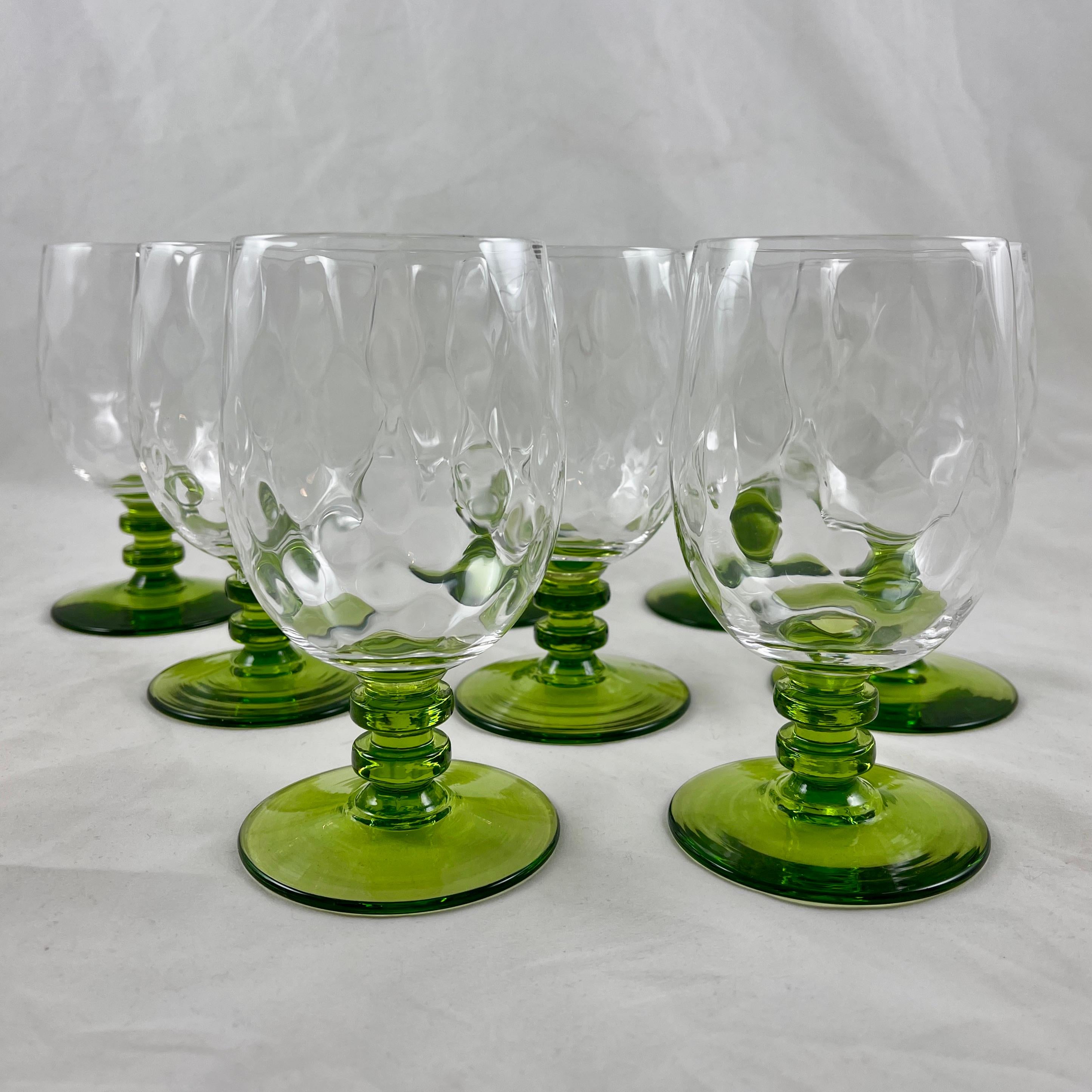 A set of eight, tall, Mid-Century Modern Era goblets in the Bryce 670 Diamond Optic pattern, Bryce Brothers Glassworks, circa 1960s.

The Diamond Optic is a blown-crystal stemware pattern produced until 1965. A multi knobbed, stacked stem in moss