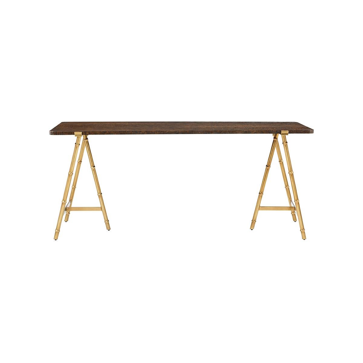 Slender lines form a light and airy design in this modern table. A graceful combination of burl wood in a warm brown polished finish atop an organic faux bois base in a satin bronze finish.

Dimensions: 72