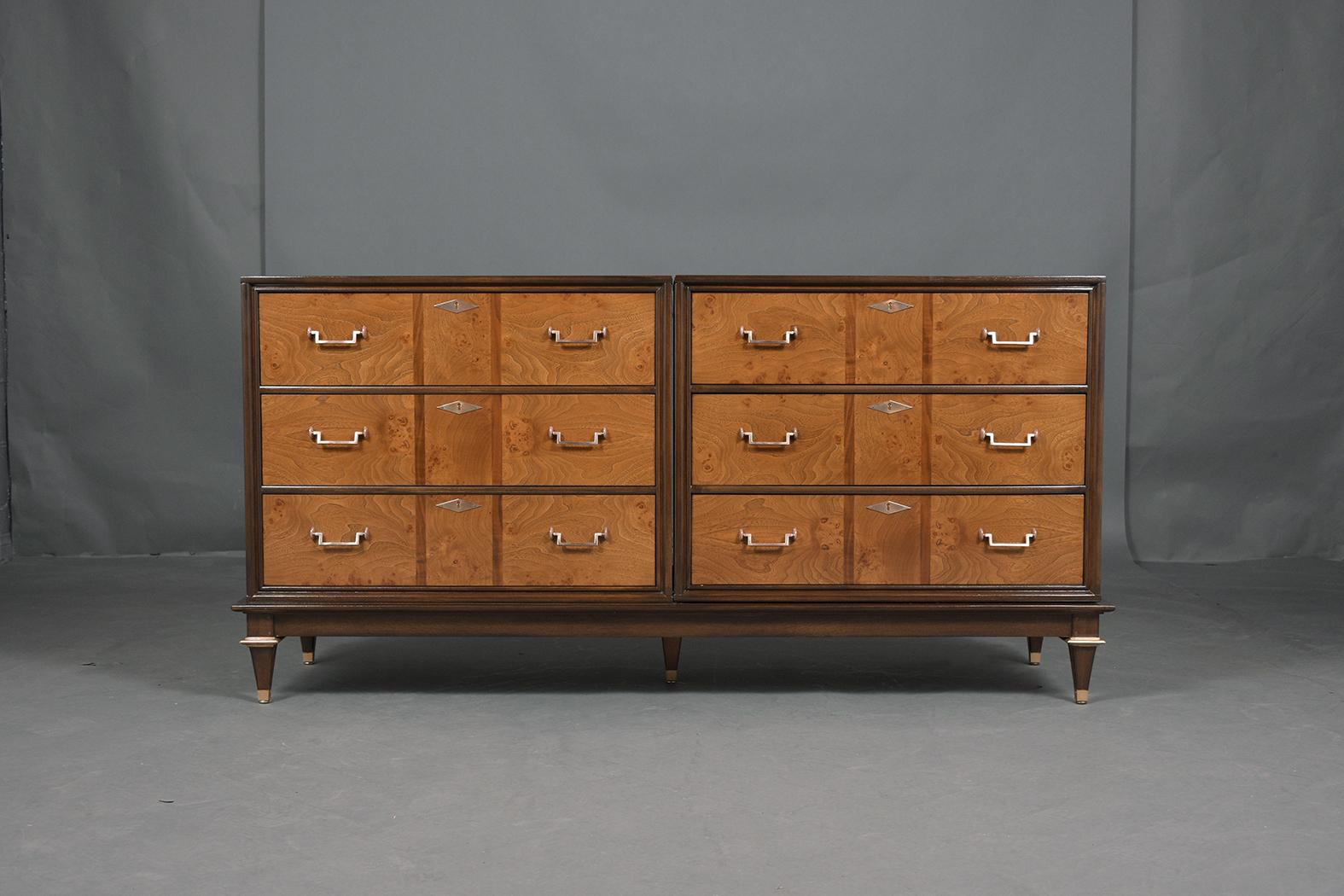 Embrace the elegance of the mid-century era with our meticulously restored Burled Chest of Drawers, a masterpiece of craftsmanship and design. This dresser, brought back to life by our skilled in-house craftsmen, offers not just unparalleled