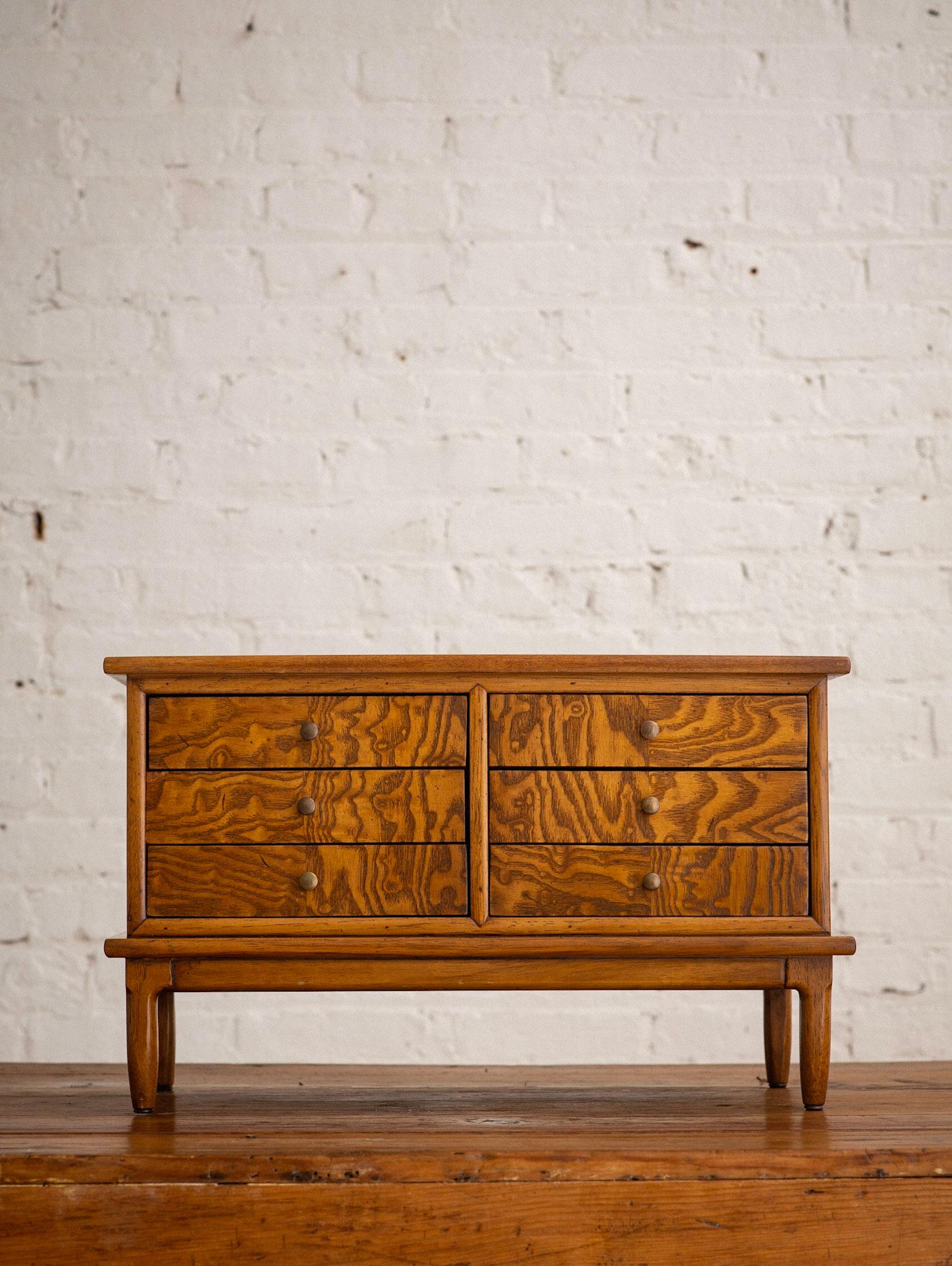 A mid-century wooden jewelry box by Tomlinson 