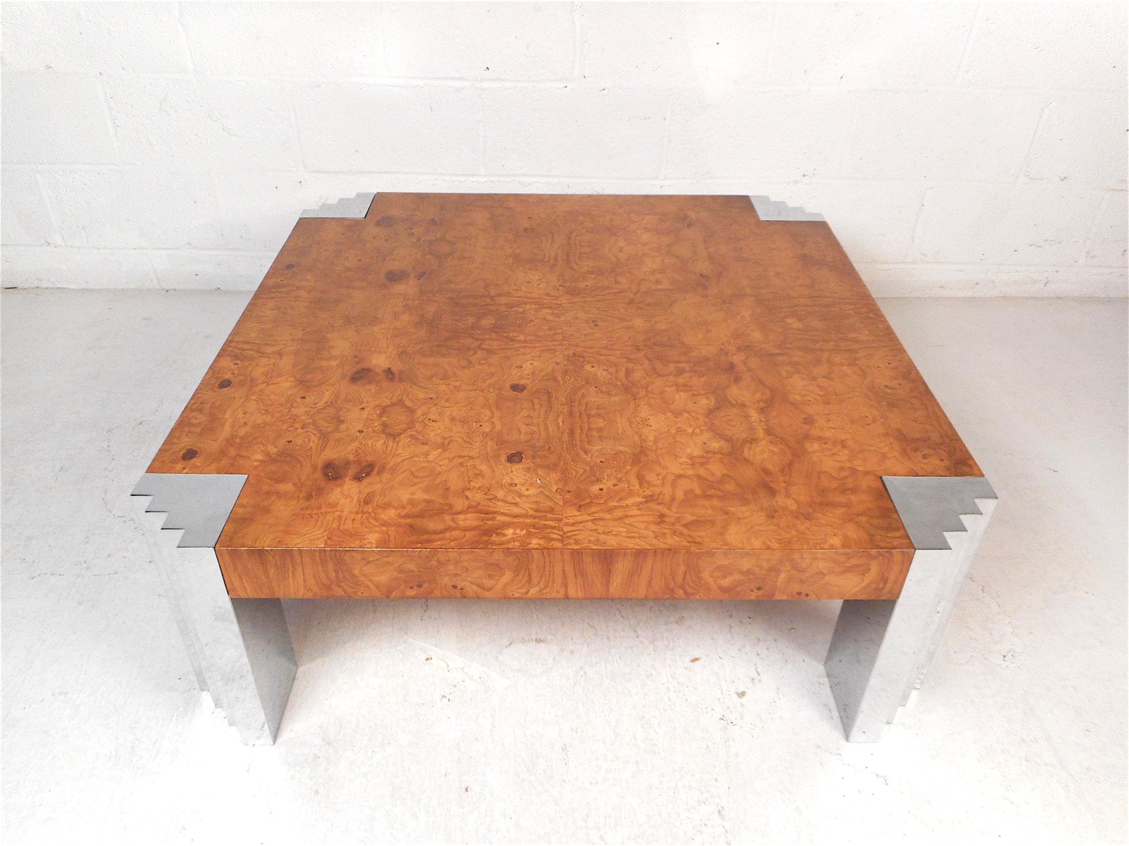 Stunning midcentury coffee/cocktail table with a burl maple tabletop, along with chrome supports on each corner of the table. Great table styled after Milo Baughman. Sure to make an impression in any modern interior. Please confirm item location