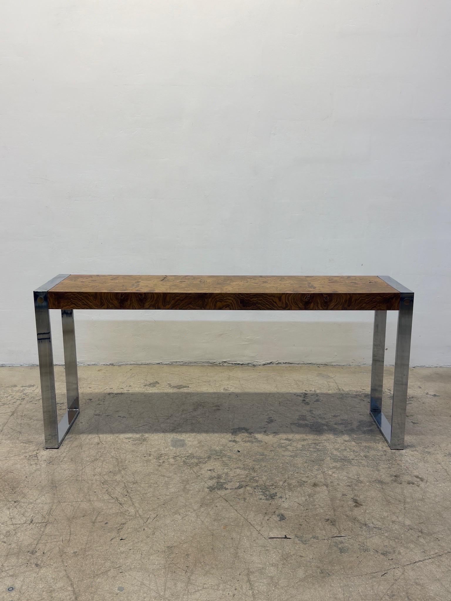 Mid-Century Drexel console table with burlwood veneer top on a polished chrome base with brass accents.