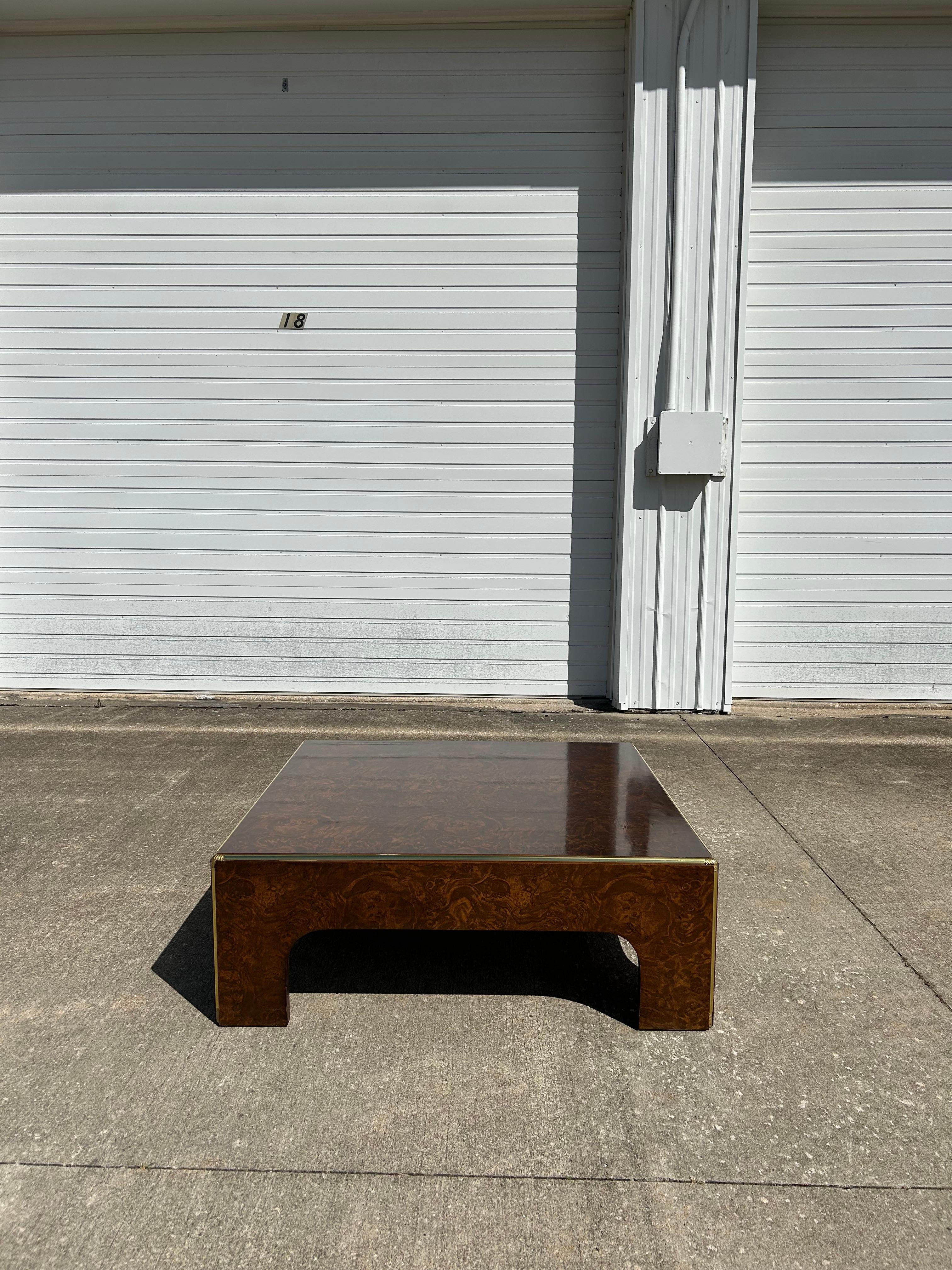 Mid-Century Burlwood Expansive Cocktail Table with Brass Details. It is in good condition, please see pictures. This piece would be a great addition to an office, home bar or seating area. 