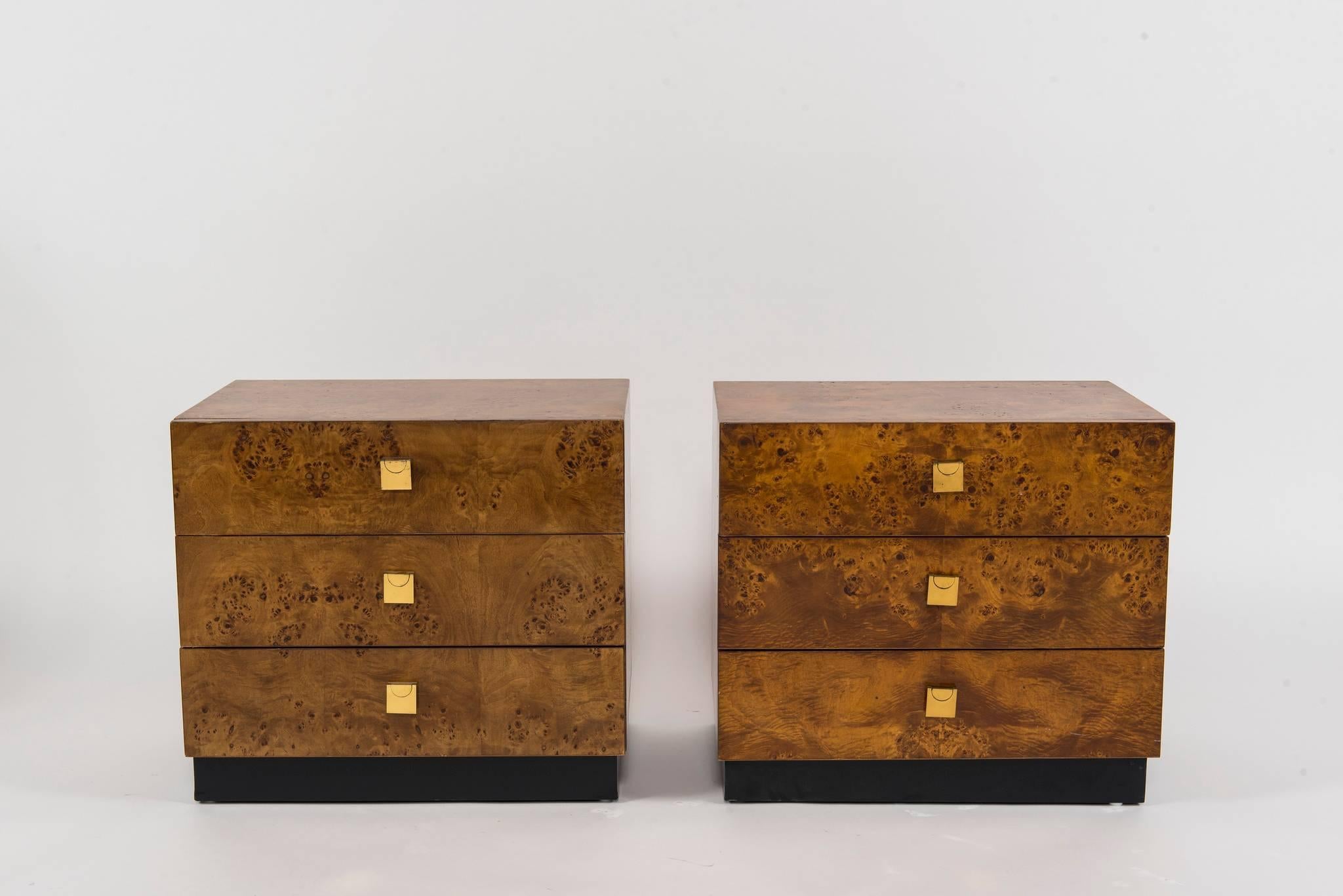 A pair of midcentury Founders burl wood veneer two drawer nightstands with square brass pulls.