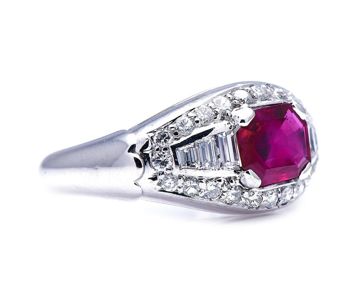 Ruby and diamond ring. This ring, set with brilliant-cut and baguette diamonds in an arrangement highly reminiscent of the ‘Trombino’ rings originally popularised by Bulgari, centres on an unheated octagonal step-cut ruby weighing approximately 1.30