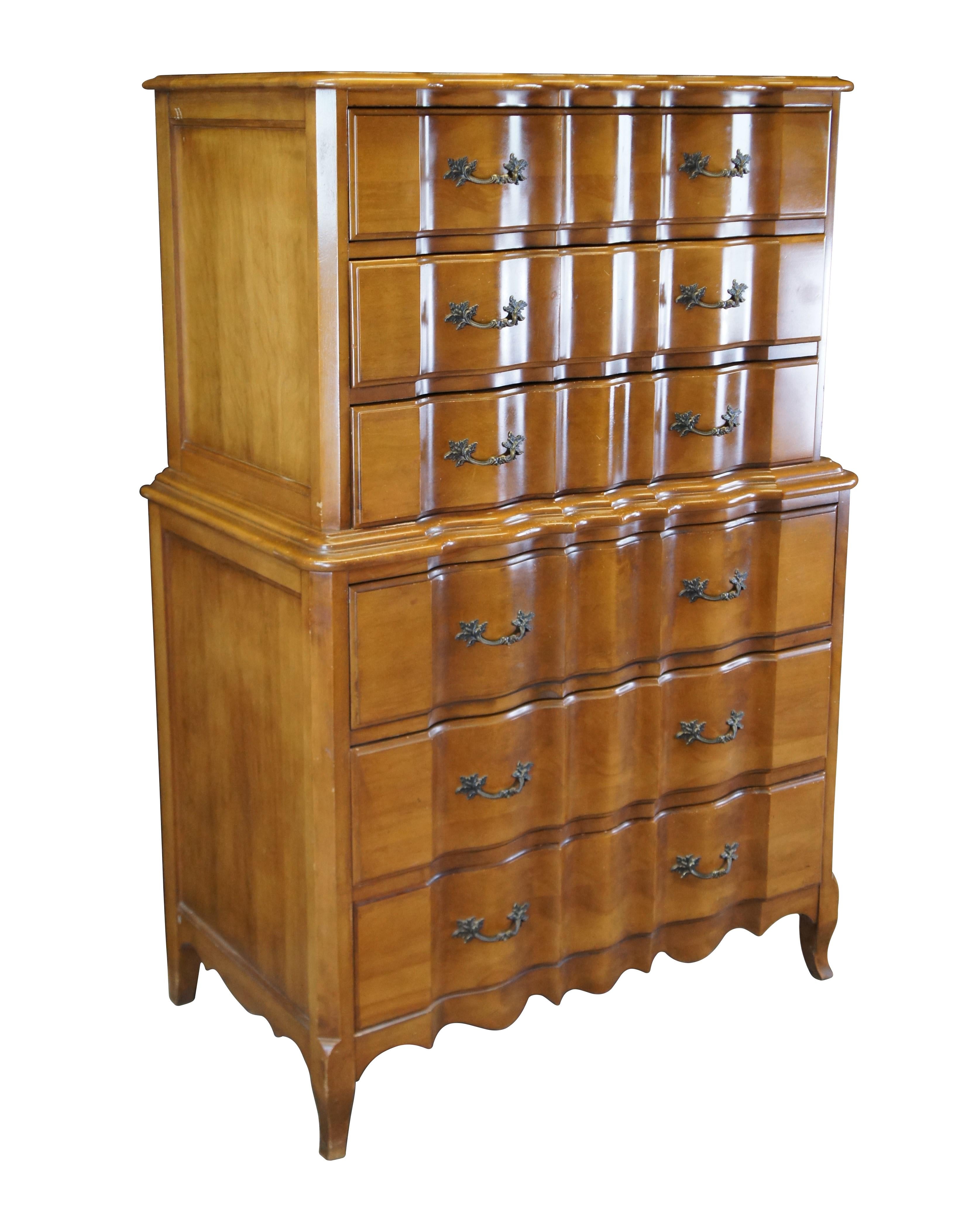 Mid Century French Provincial Burns Case Goods tallboy / highboy chest of drawers / chest on chest style dresser.  Made of walnut featuring serpentine form with six drawers and brass hardware.

Burns Furniture Company, Founded 1939, a subsidiary of