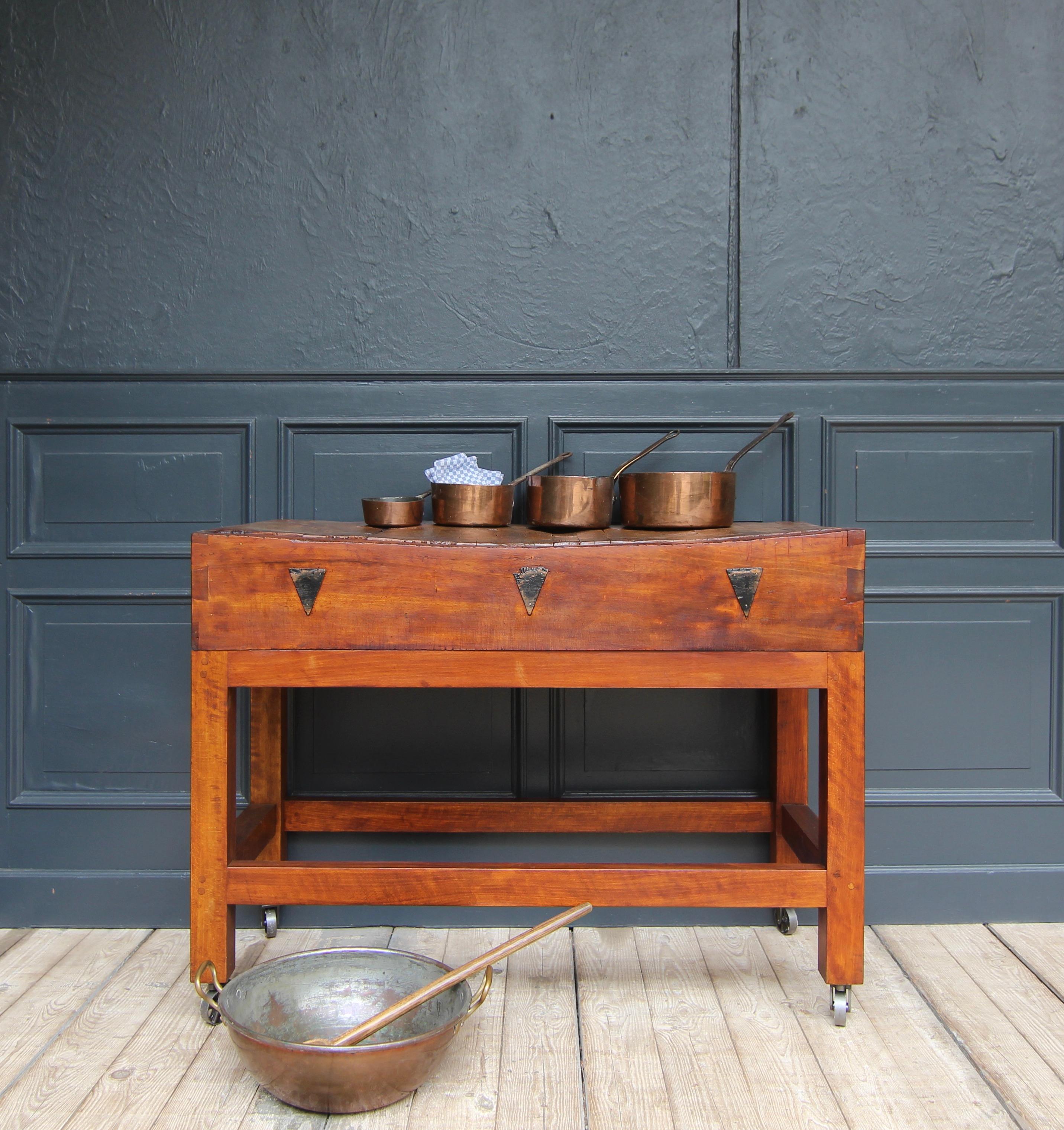 A mid-century freestanding butcher's block. Perfect as a kitchen island. Ready for everyday use.

Made of solid stained beech and elm wood. Straight-lined frame on 4 industrial castors with a rectangular base, consisting of square timbers connected