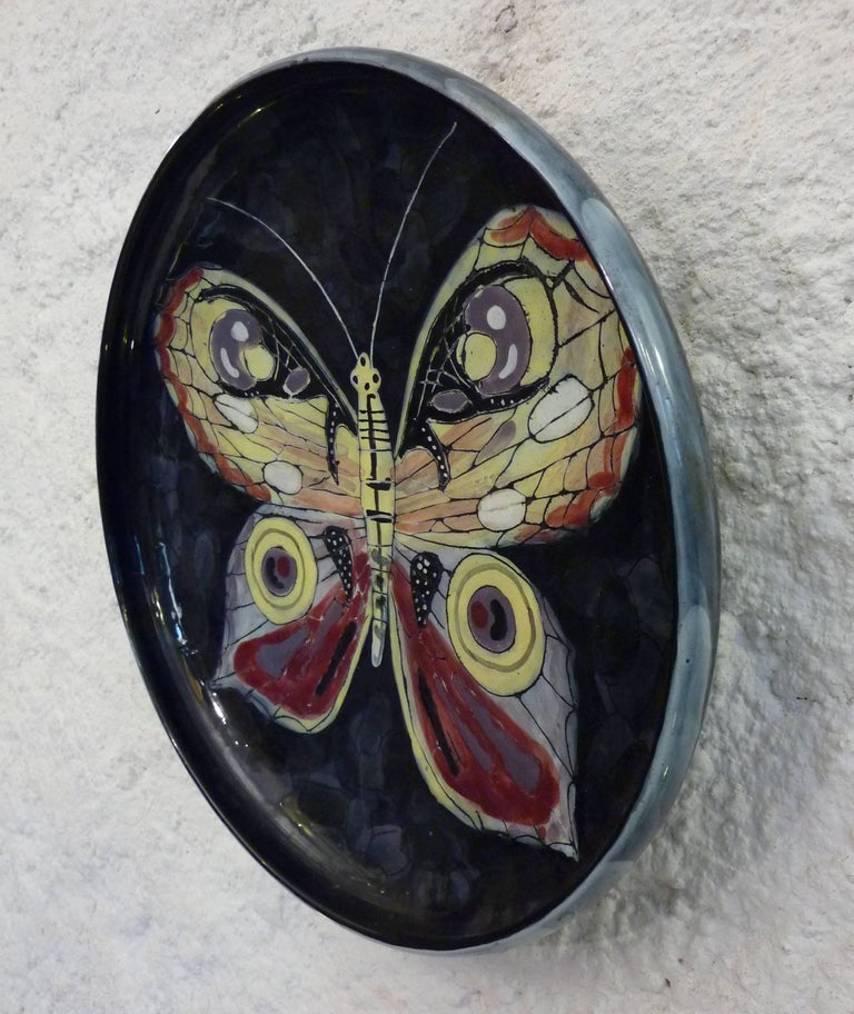 Italian ceramic bowl with a curved rim depicting a fantasy butterfly, possible to hang on the wall or for practical use. By San Polo ceramics Venezia made in the 1950s by the renowned San Polo ceramics in Venezia. Signed 