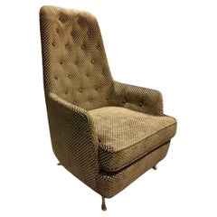 Sillón de mediados de siglo con reposabrazos y patas de metal