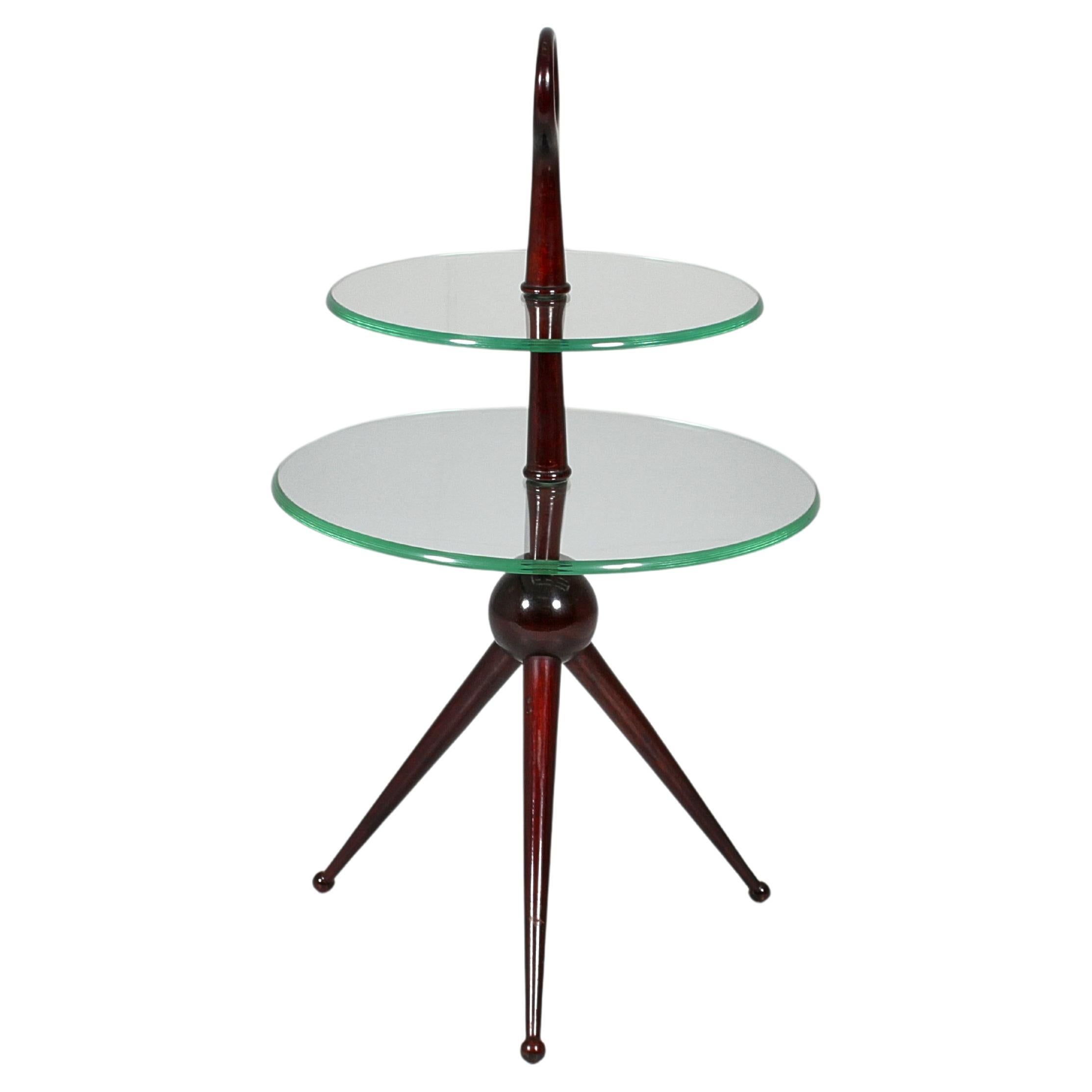 Delightful wooden tripod side table  with a double circular top in cut glass, the upper one having a smaller diameter. By Cesare Lacca, Italy 1950s.
Wear consistent with age and use.