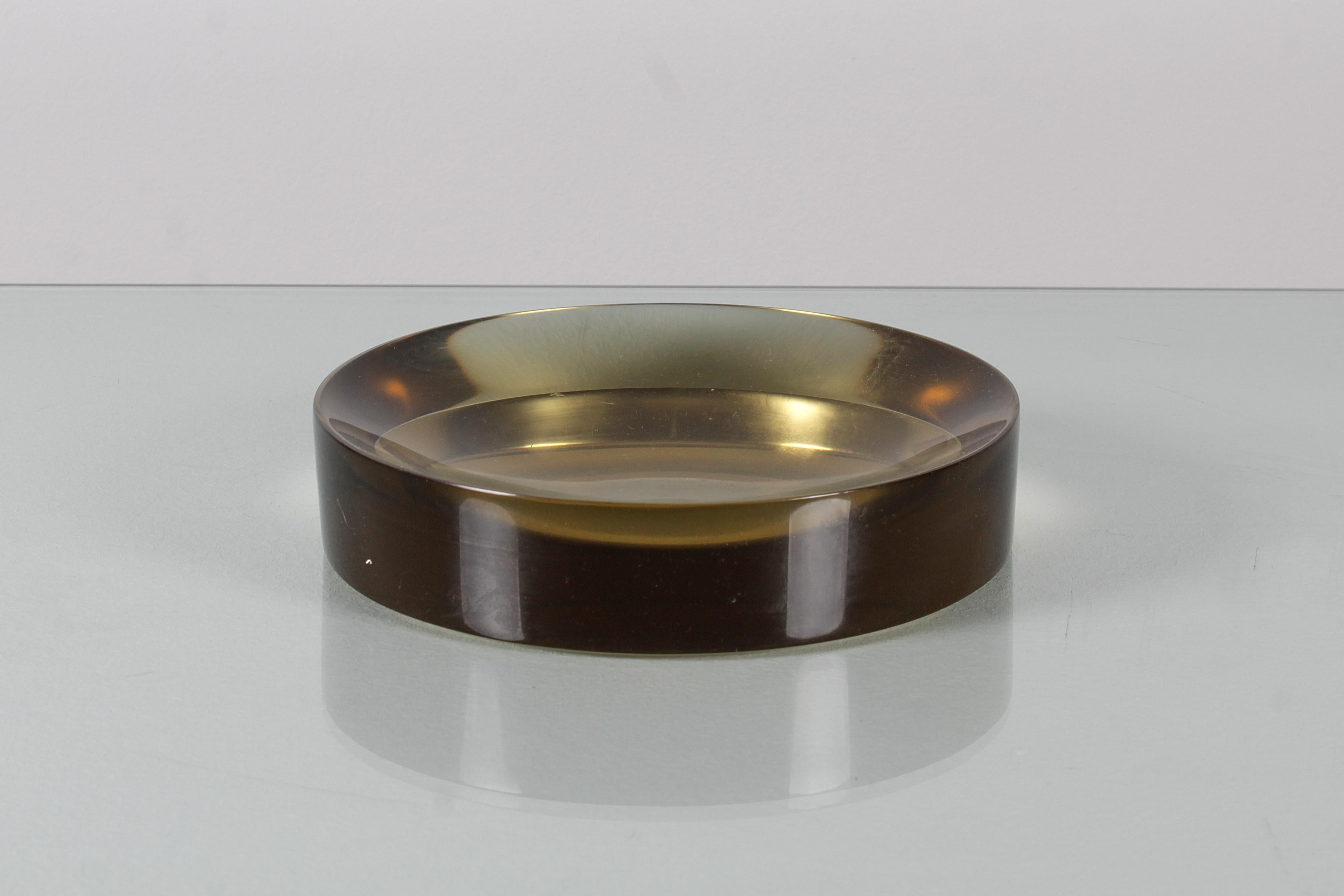 Very refined circular pocket emptier in solid dark yellow Murano glass. Visible a couple of very small chips on the edge of the base. Murano production by Carlo Nason, Italy 60s.