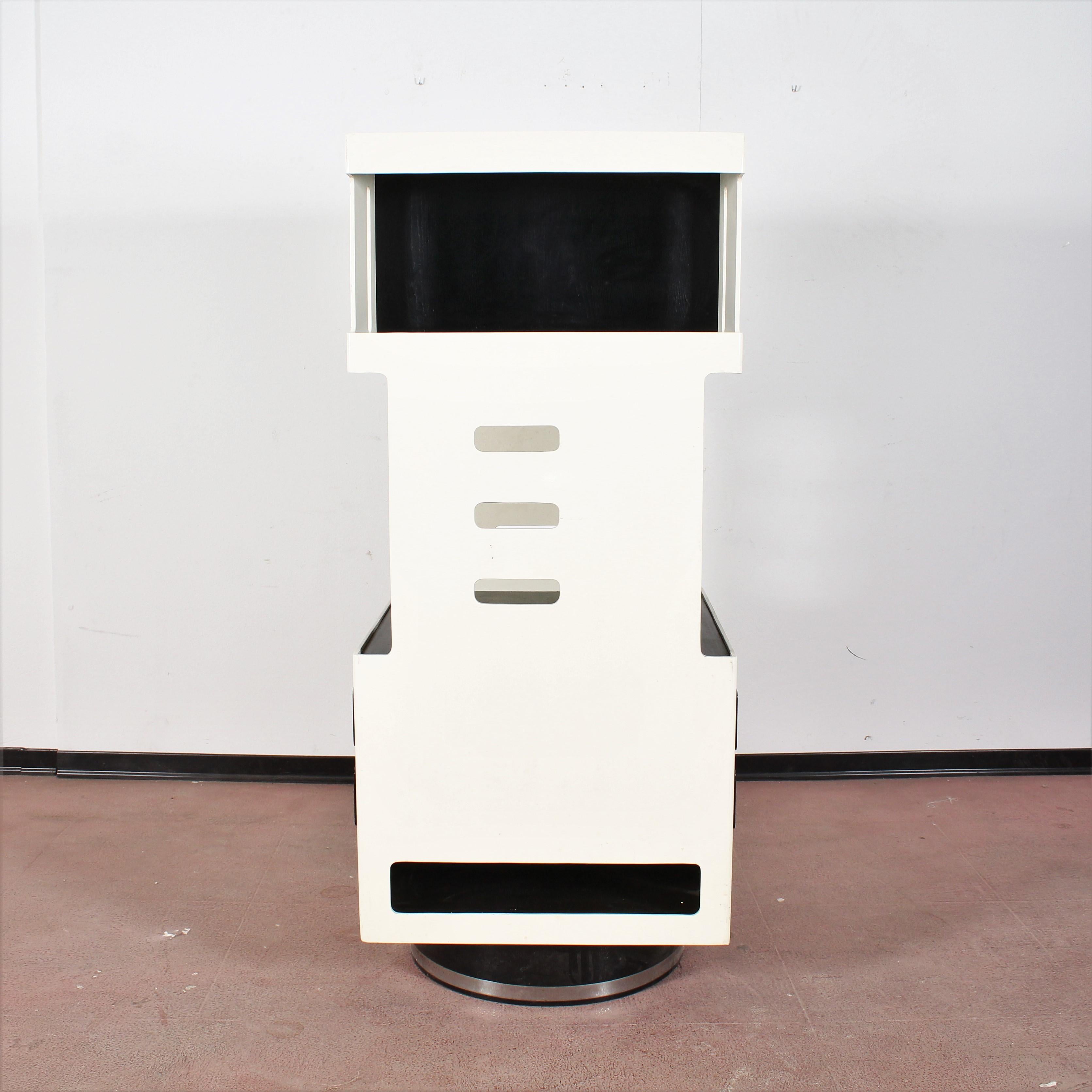 white revolving bookcase