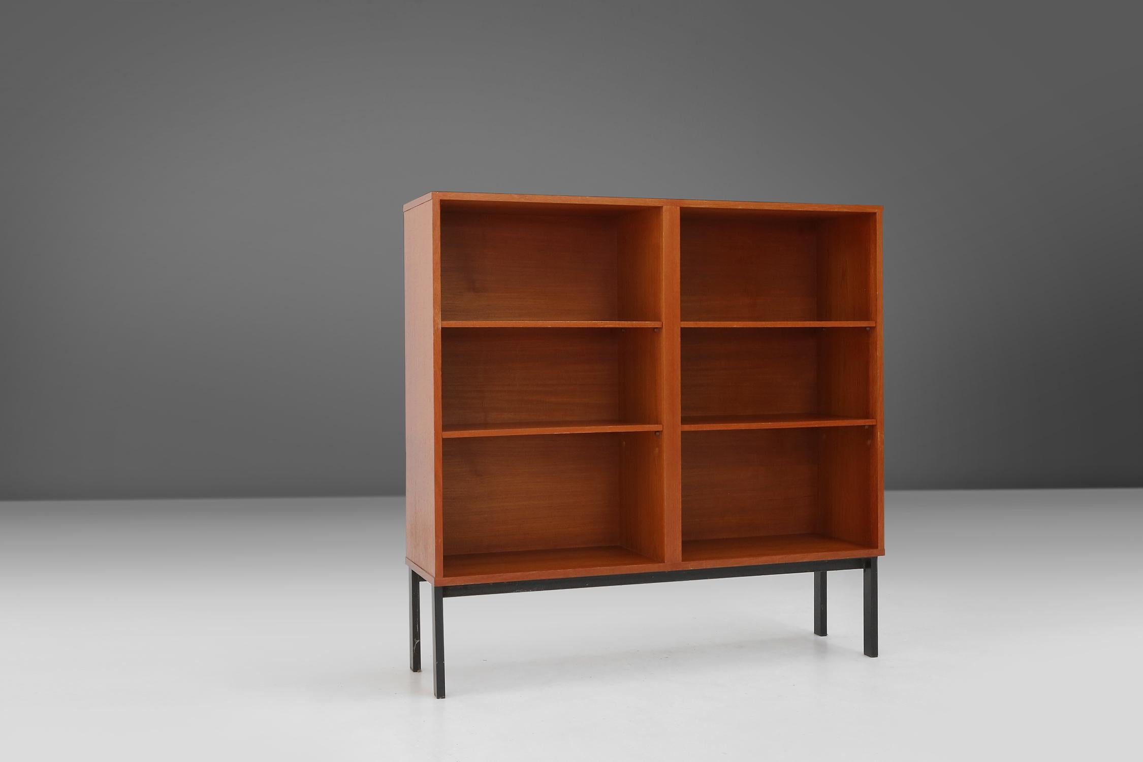 Made in Belgium in the 1960s, this mid-century cabinet combine clean lines, organic shapes and functional beauty. The teak wood is a durable and natural material, which has a warm and elegant look. The metal base gives a nice contrast to the