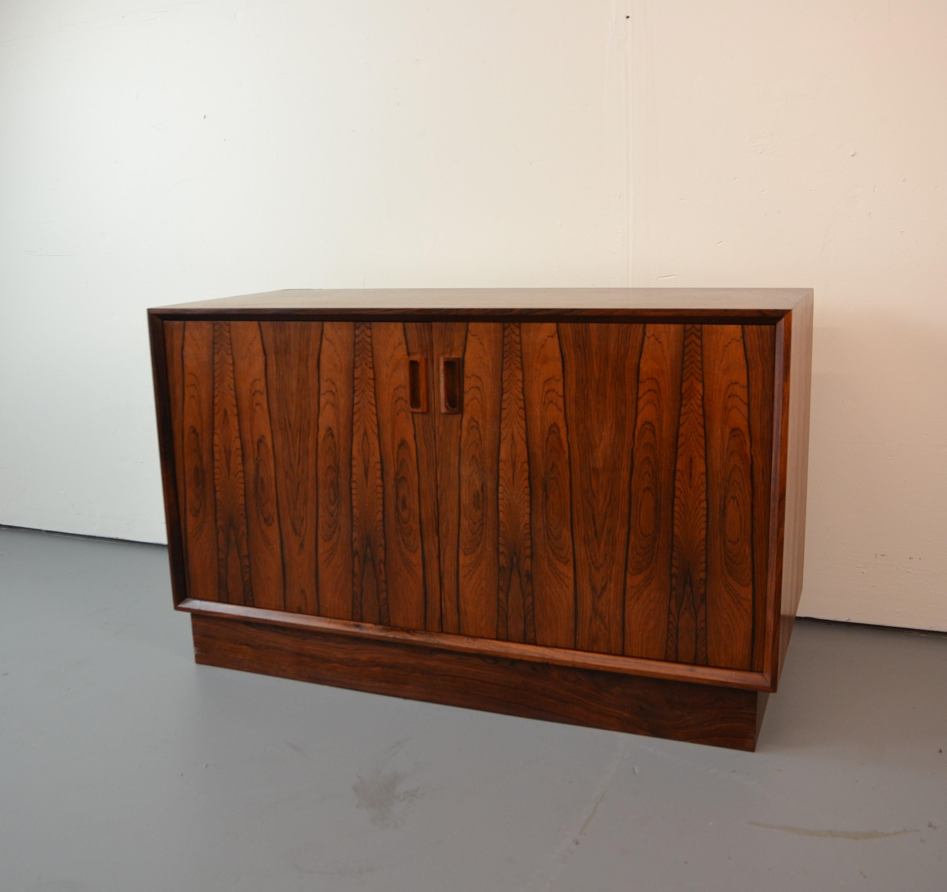 Mid-century rosewood cabinet with two doors and a single adjustable shelf by Borge Mogensen.