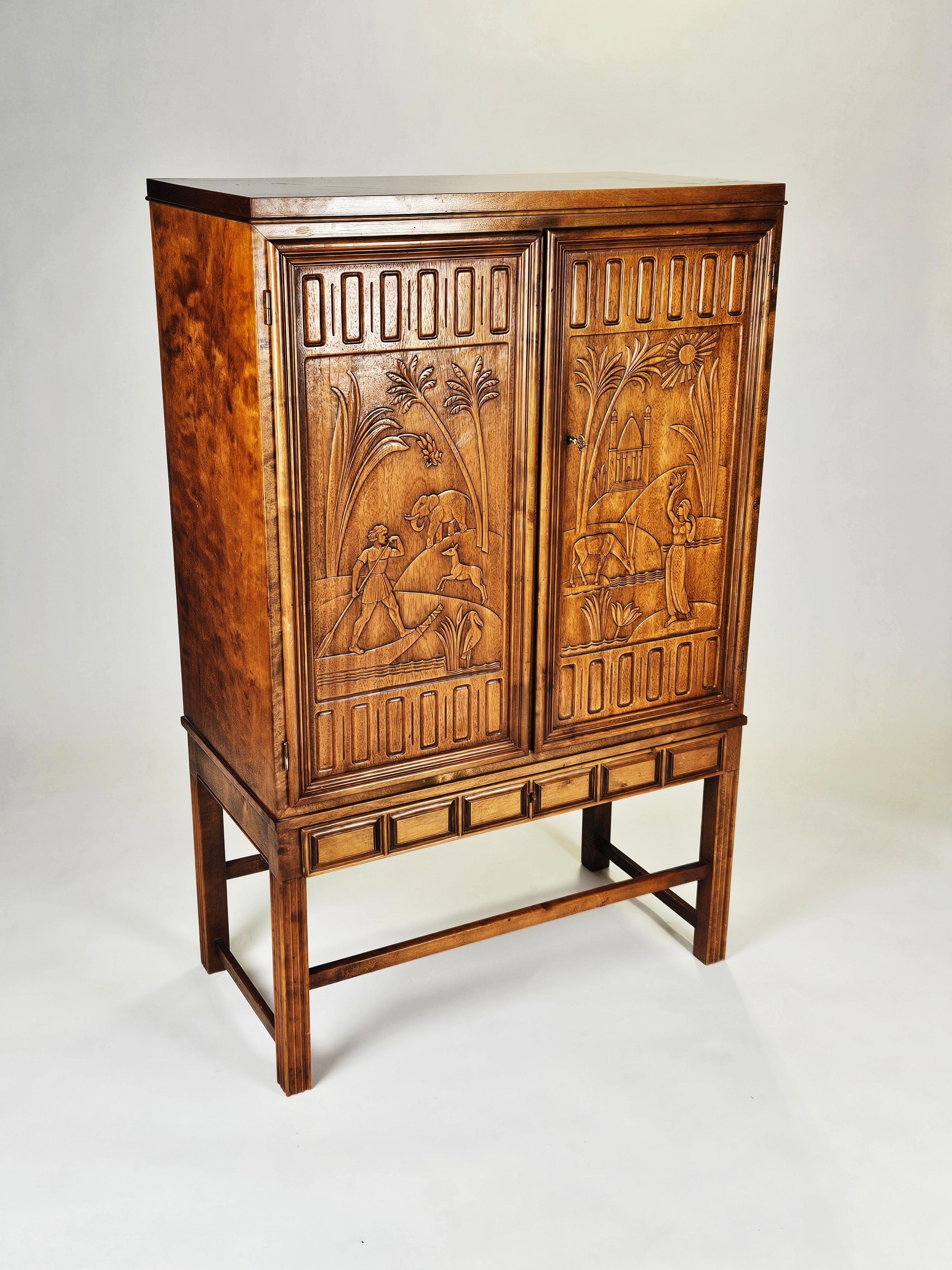 Cabinet made by Eugen Höglund and made in Sweden during the 1950s. 

Produced in stained beech with a beautiful carved relief. 