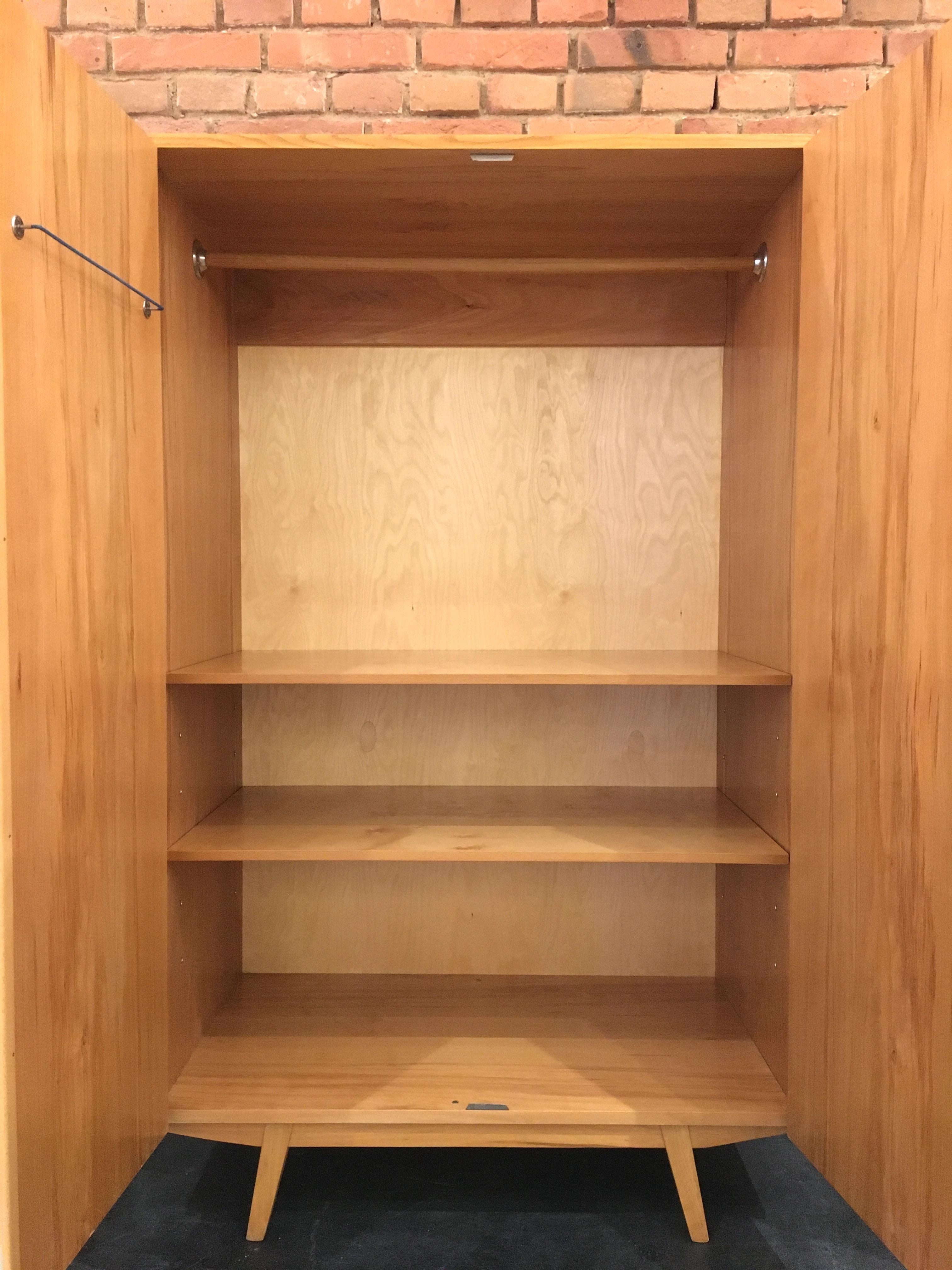 This cabinet, with a very beautiful interior life made in the 1960s in the former Czechoslovakia. Completely restored. Hanks to the removable shelves, the linen cupboard can be transformed into a pure wardrobe.