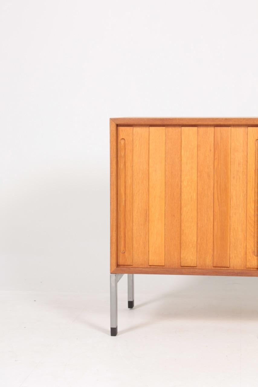 Cabinet in oak, designed by Hans J Wegner for RY cabinetmakers in the late 1950s.