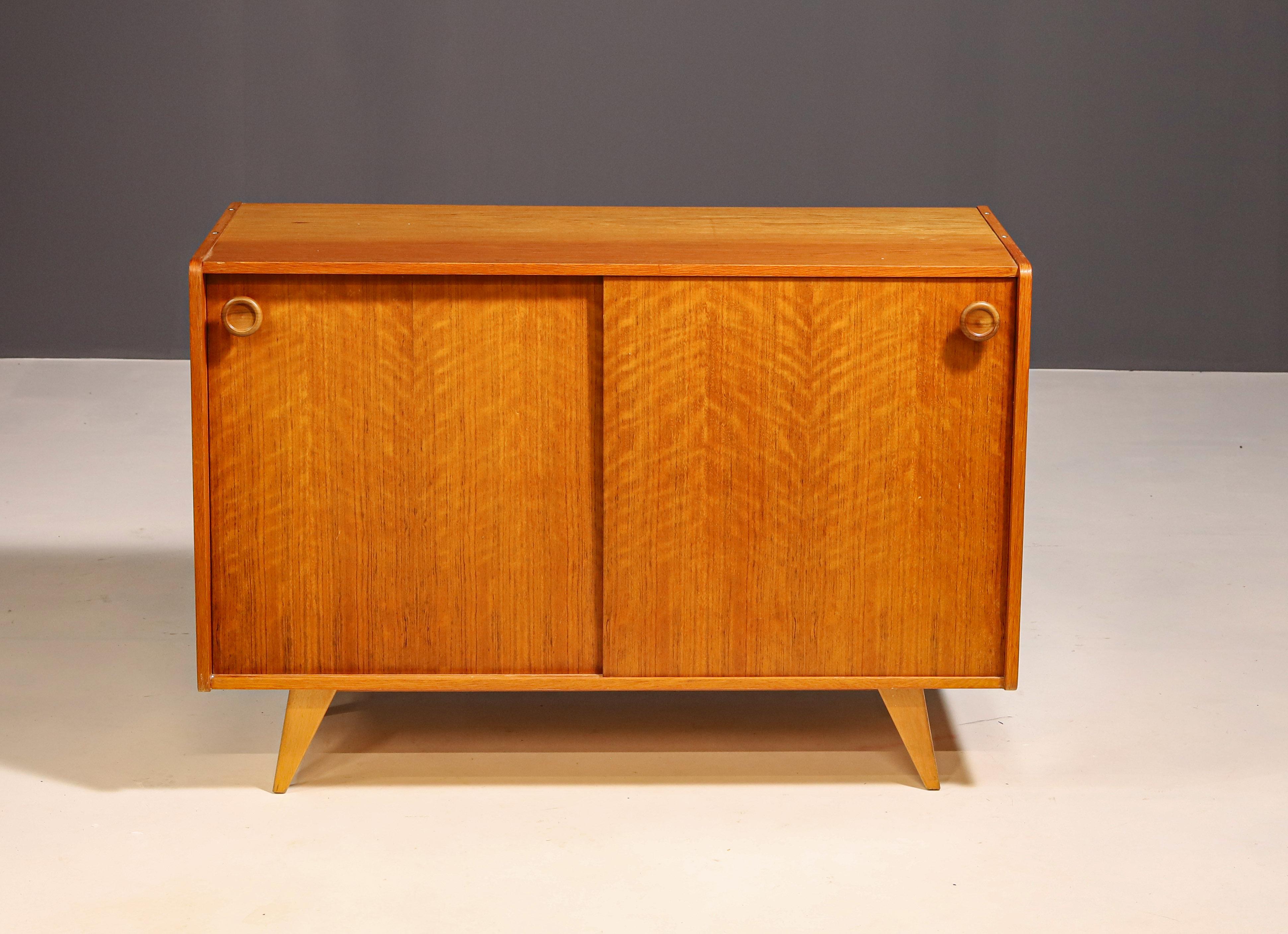 Mid century chest of drawers made by Jiří Jiroutek for Interiér Praha.

It’s a non-tradional version of well-known cabinet- catalogue No. U452 by Jiří Jiroutek.  Made of wood and plywood.  It´s in good Vintage condition, shows signs of age and