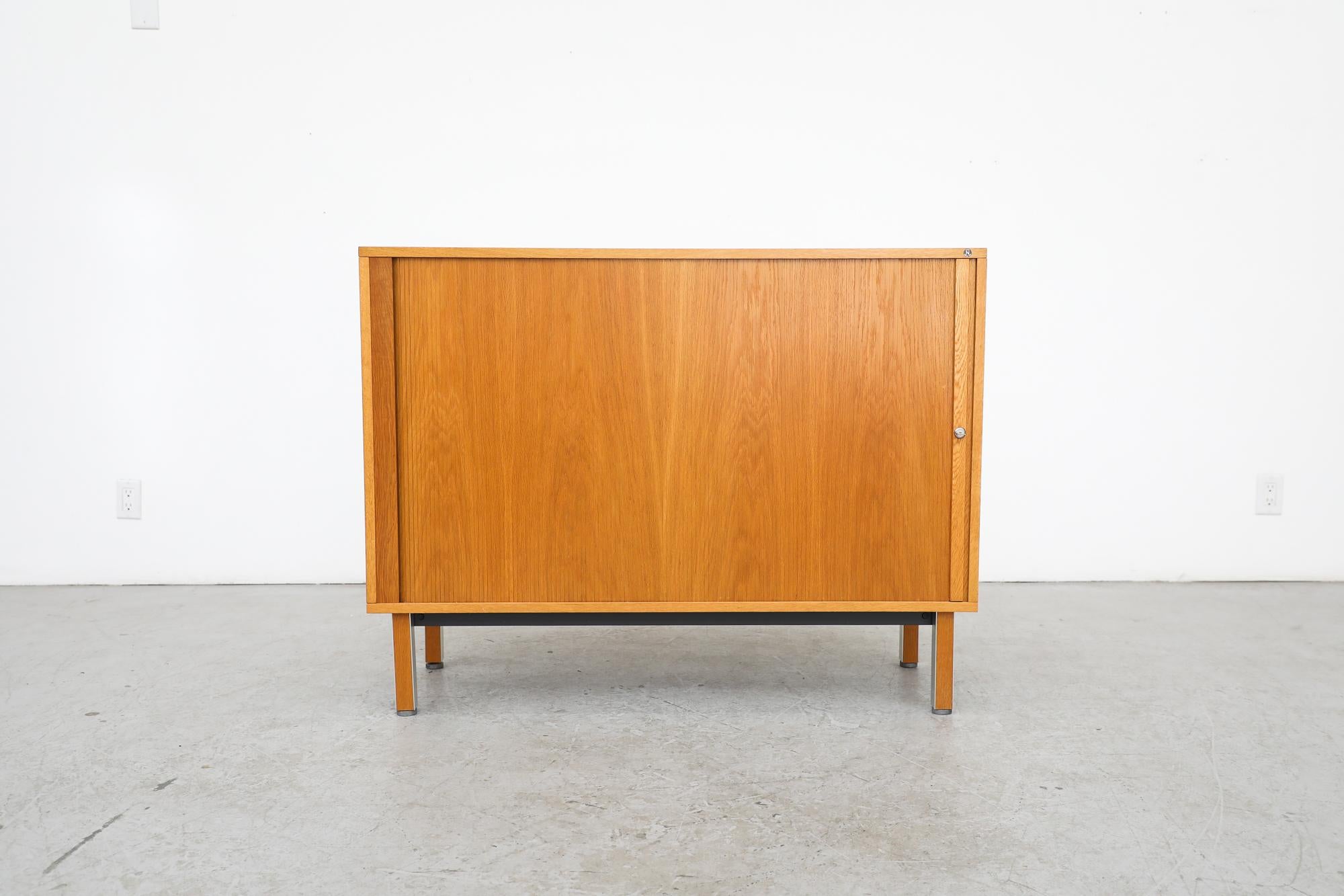 Mid-Century Nipu credenza or office cabinet with sliding tambour door, multiple cubbies and a pullout orange enameled metal file racks for hanging files. (May need to modify for smaller/larger files at an office supply store) Perfectly suited for an