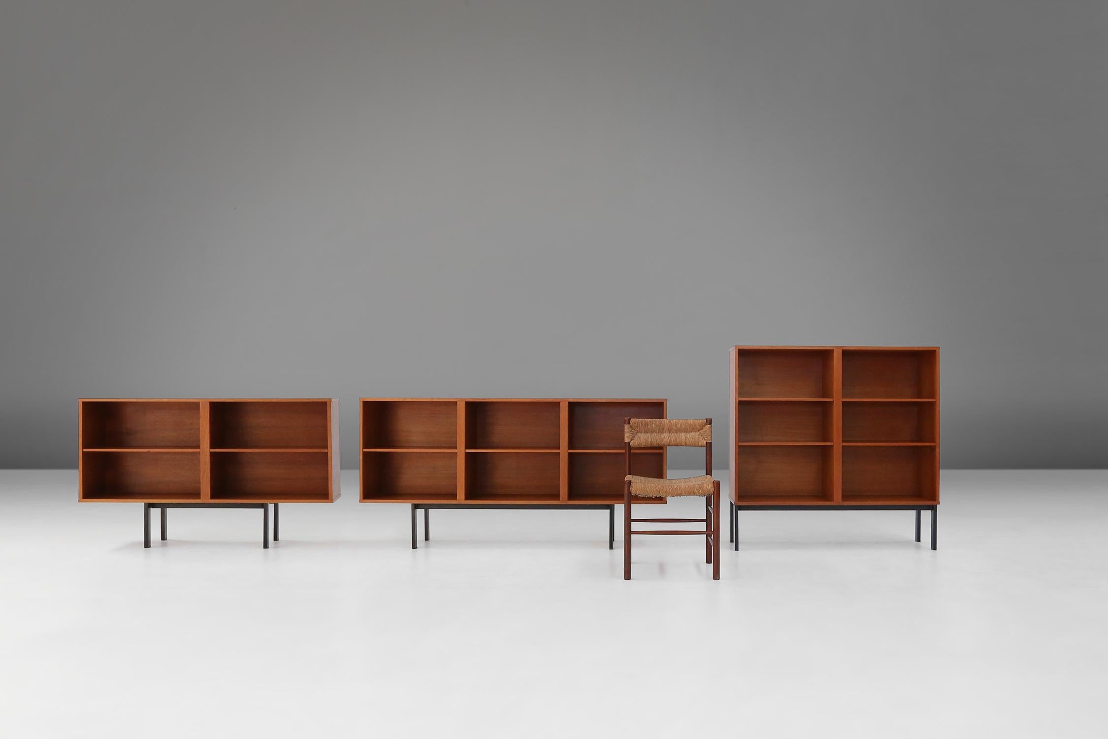 Made in Belgium in the 1960s, these mid-century cabinets combine clean lines, organic shapes and functional beauty. The teak wood is a durable and natural material, which has a warm and elegant look. The metal base gives a nice contrast to the