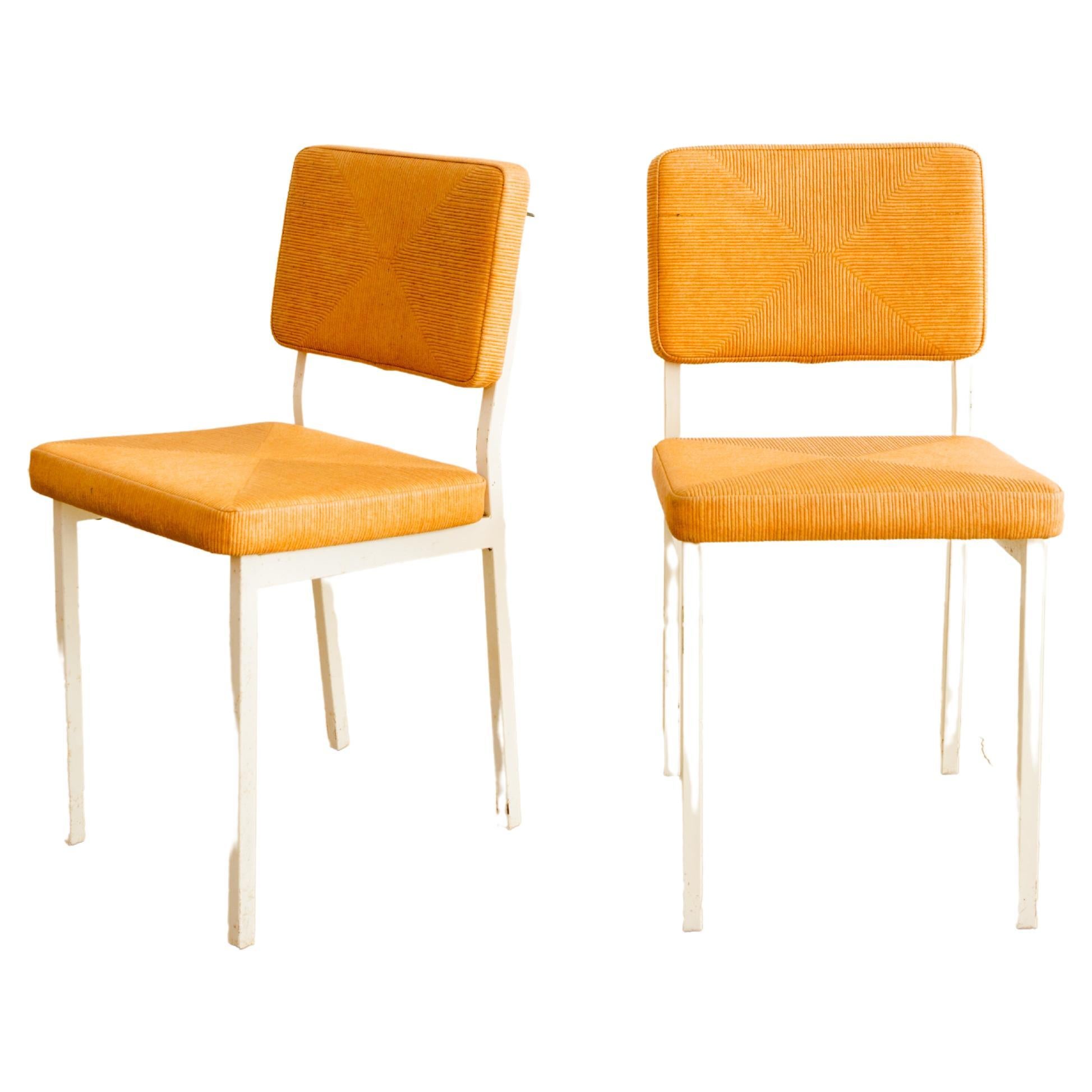 Set of six textured vinyl café chairs with painted metal frames. 